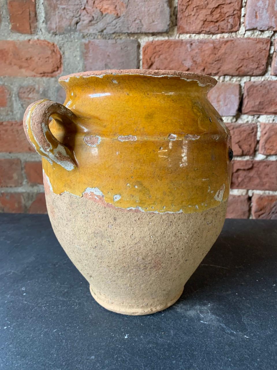 A nice 19th century French Confit pot of medium size. These were buried in the ground to keep food produce cool. The unglazed bottom was the part that was buried.