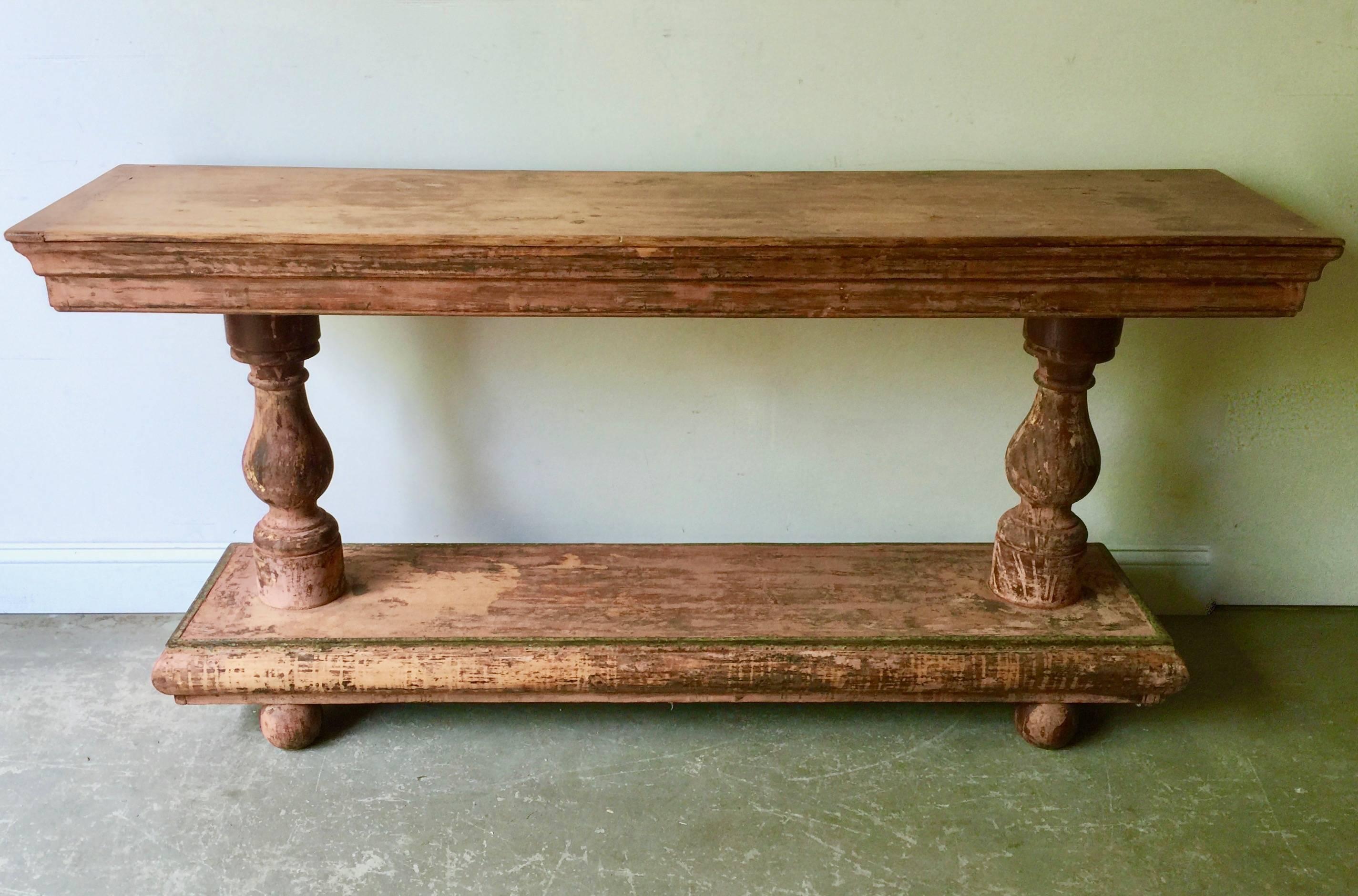 A handsome French 19th century console/cloth display with turned bases supported by carved legs. Wonderful patinated surface offering a generous display place for any decor with one drawer and time worn brass edge of the base.
Here are few examples