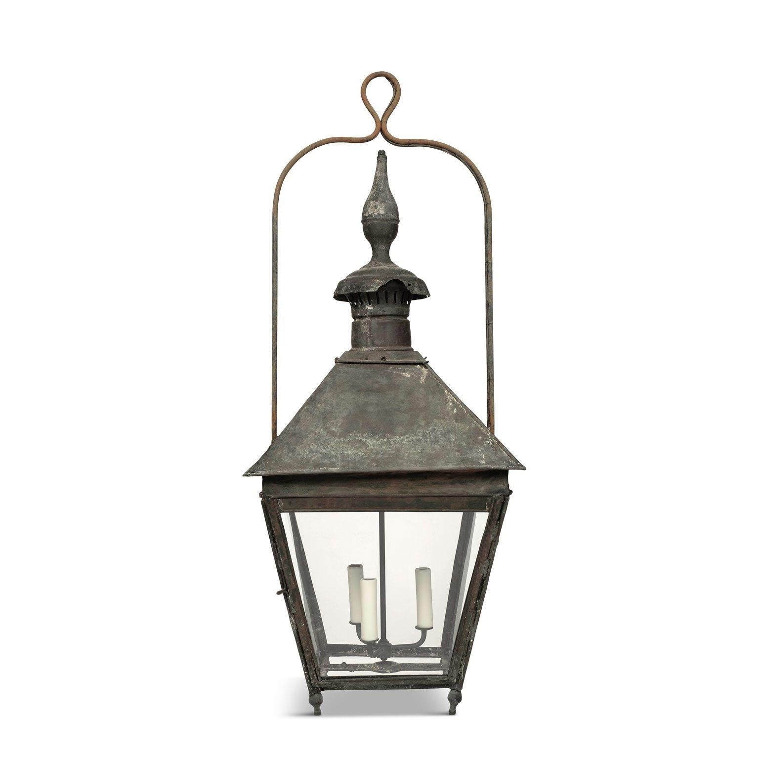 19th century French Copper and glass paneled lantern circa 1850-1889. Beautiful natural verdigris green patina and nice, large scale. Originally served as a gas-lit street lantern - now newly wired with a drop-cluster of three candelabra lights.