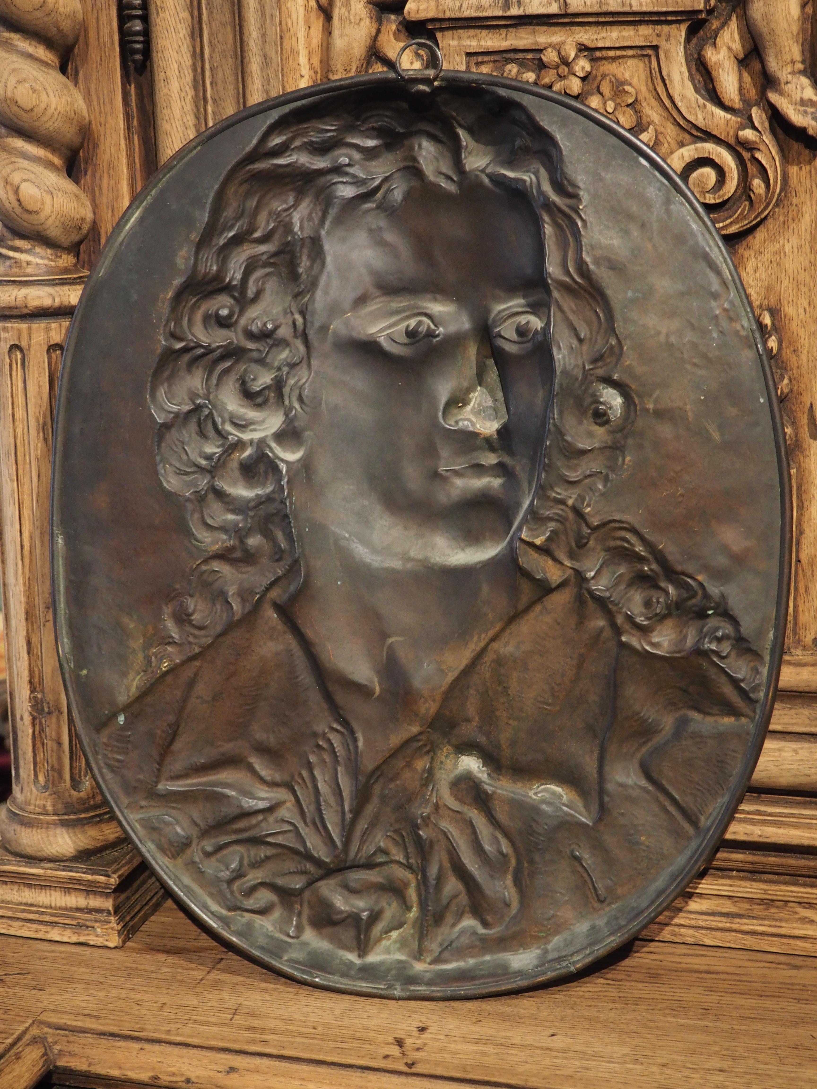 Using the ancient metalworking technique known as repousse, this copper bas relief plaque of a young nobleman was hand-chiseled by a French artist in the 1800’s. Repousse requires the metal to be “punched” from the backside, meaning that the image