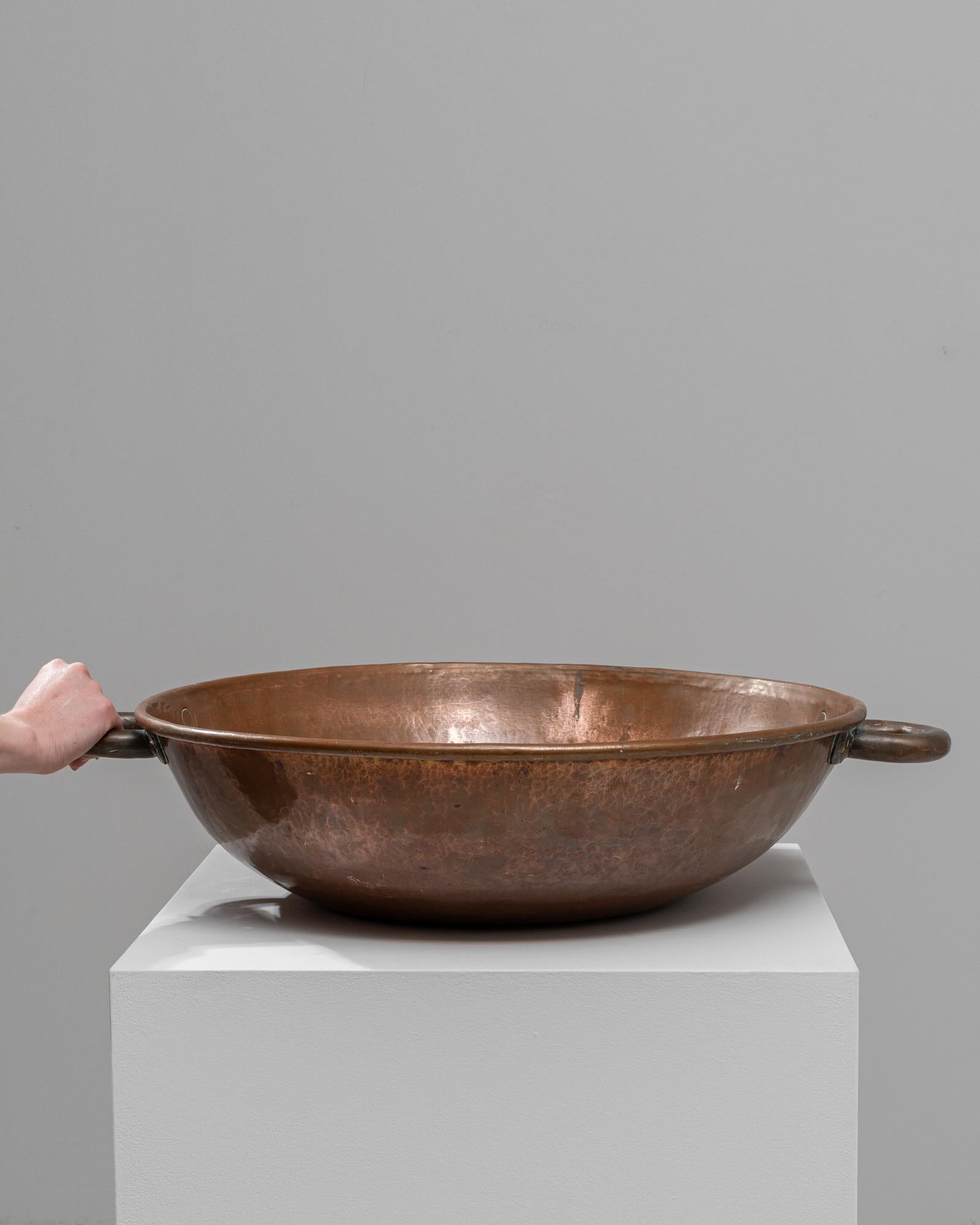 Add a touch of vintage elegance to your kitchen or dining area with this exquisite 19th-century French copper bowl. Crafted from high-quality copper, this bowl showcases a rich, warm patina that only centuries of use can produce, giving it a
