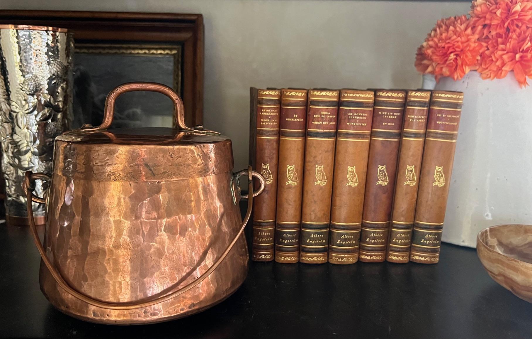 Antique copper cauldron and lid, handmade in the 19th century in France.  Originally this piece would have been a fireside cooking pot or hung from inside the fireplace to keep food inside warm.  Fill it with ice and use it as a unique champagne