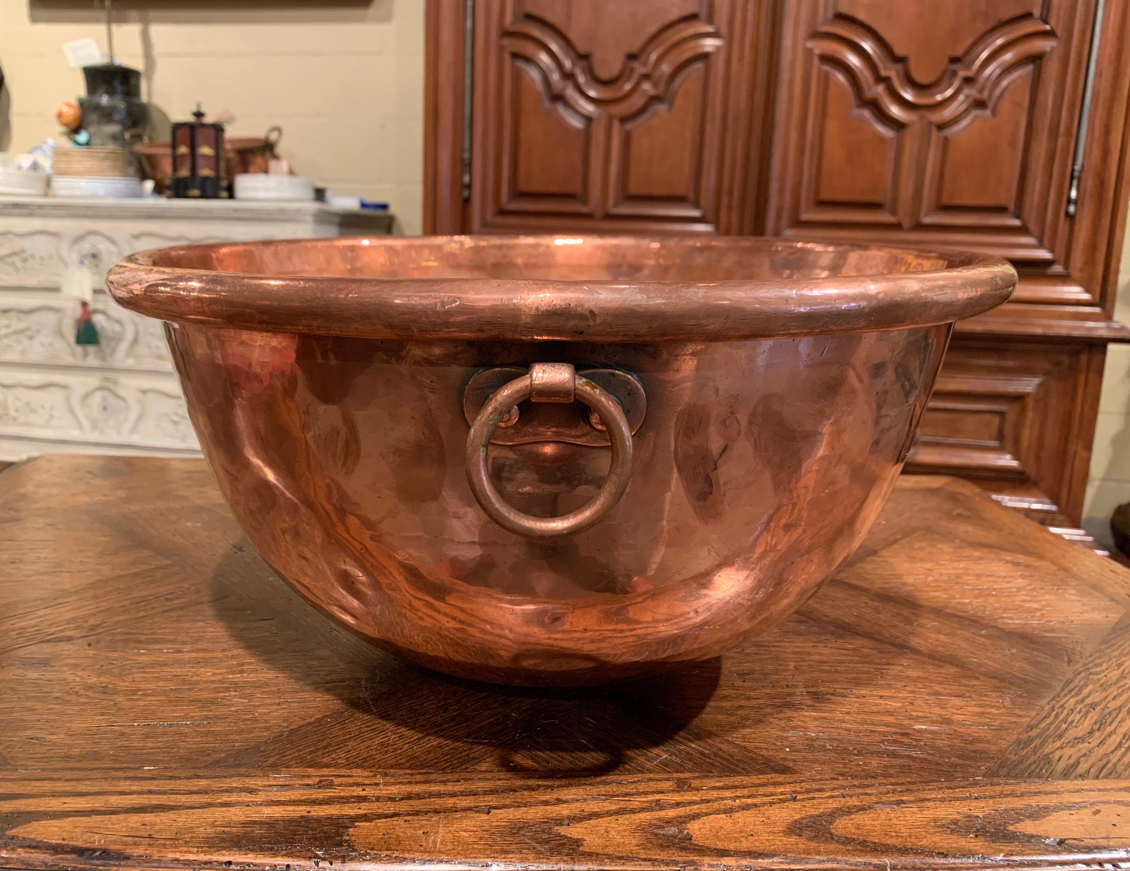 Keep your wine or beer chilled in style with this elegant round bowl; crafted in Northern France circa 1870 and originally used for homemade jelly, the circular copper bowl with rounded rim and small round side handles attached with rivets. The dish