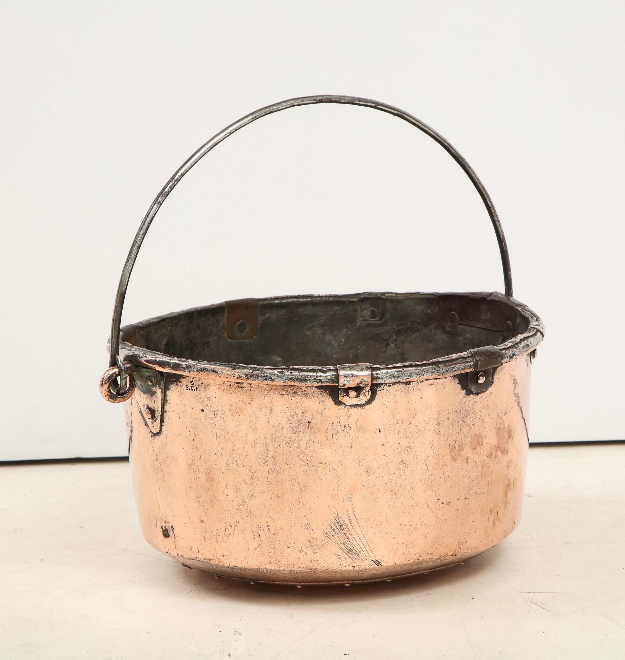 Good 19th century French copper pail, having wrought iron handle and banding with hammered copper body and hand riveted seams.