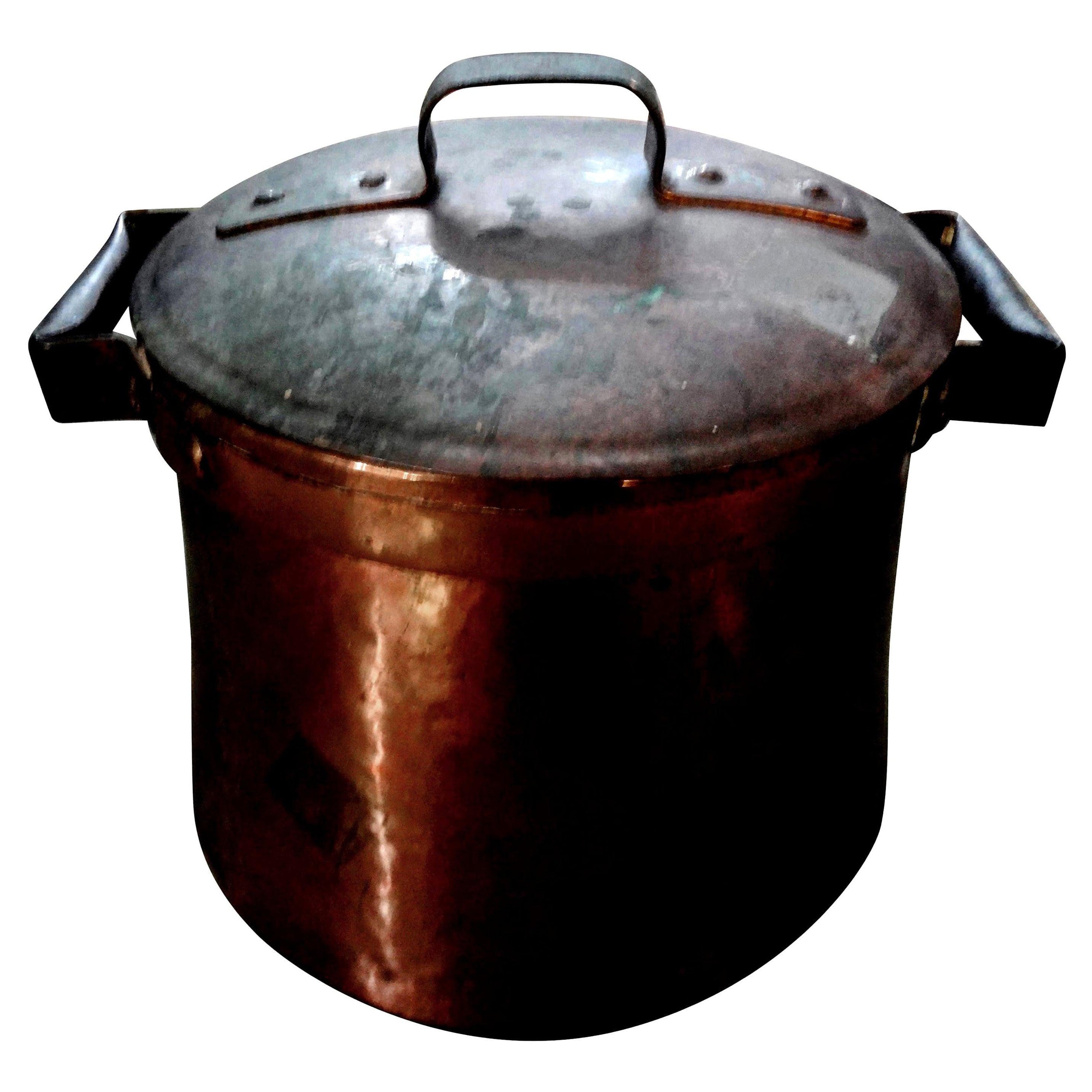 19th century French copper pot with lid.
Beautiful 19th century French Provincial copper cooking pot with original lid. This French piece has not been polished and makes a great decorative accessory, centerpiece, planter or wine cooler.  