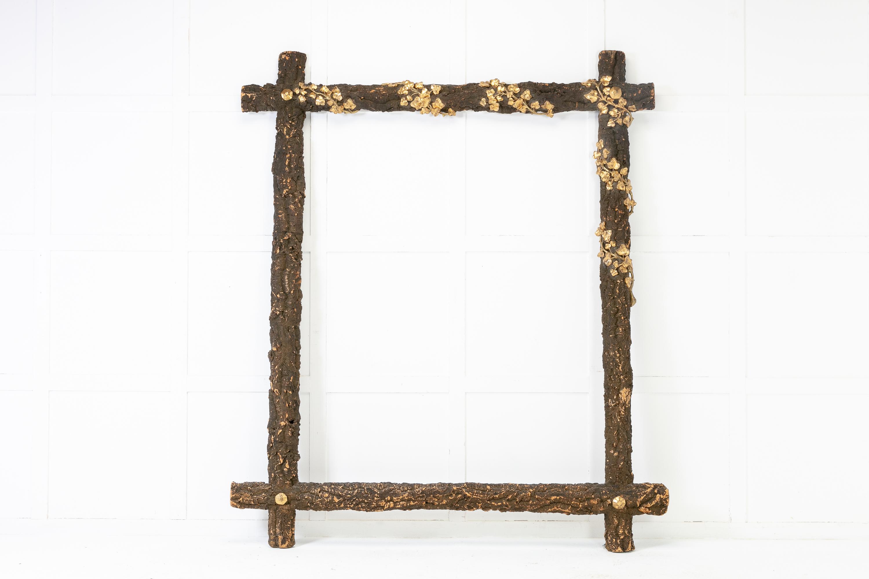An enormous, French 19th Century mirror frame made from the cork tree. Having gilded, decorative vine leaves trailing though it.
 