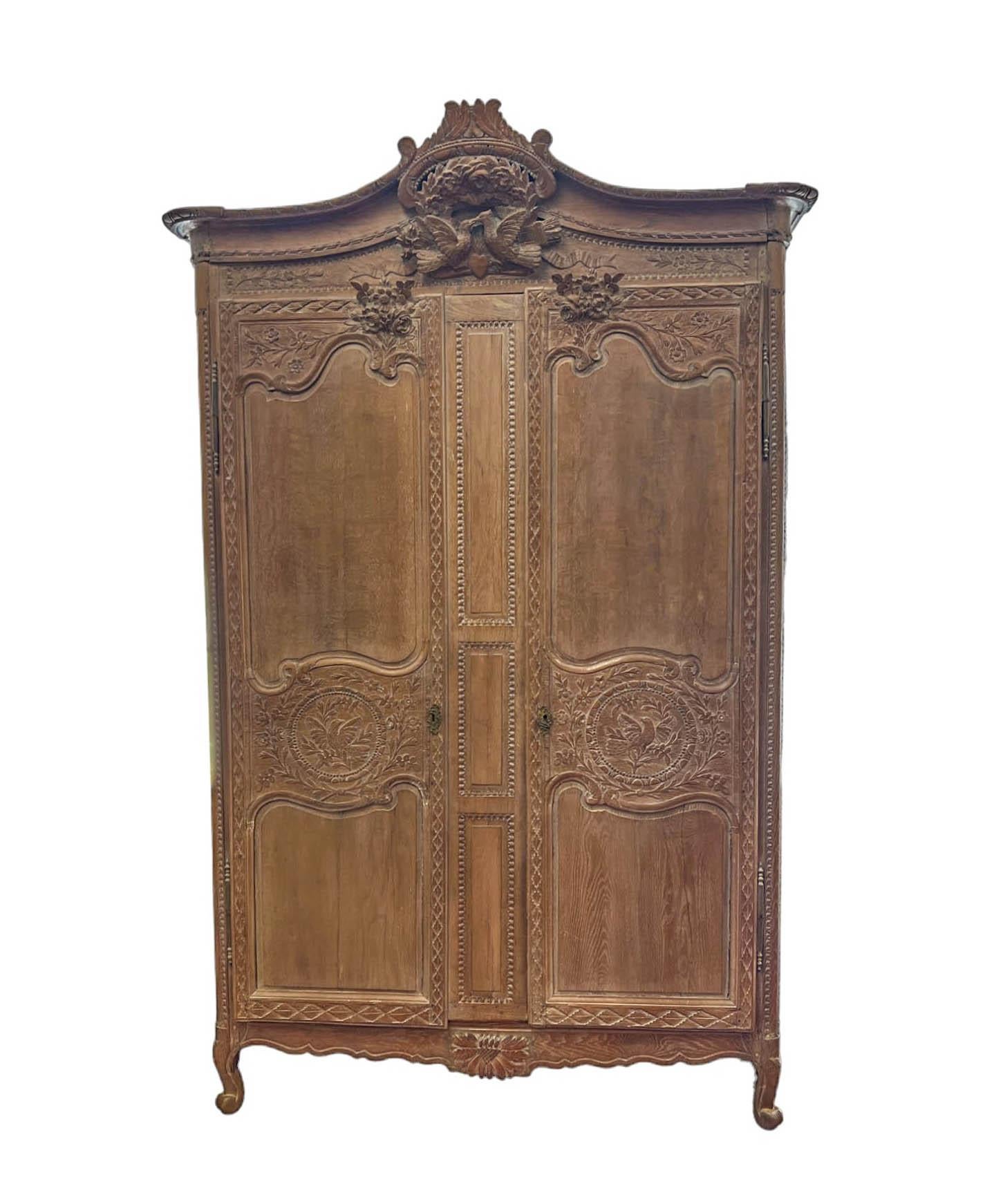 Introducing our Antique French Country Armoire in the Norman style de Bayeux, a timeless piece of history dating back to the mid to late 1800s. Crafted from oak using traditional peg construction techniques, this armoire has been transformed into a