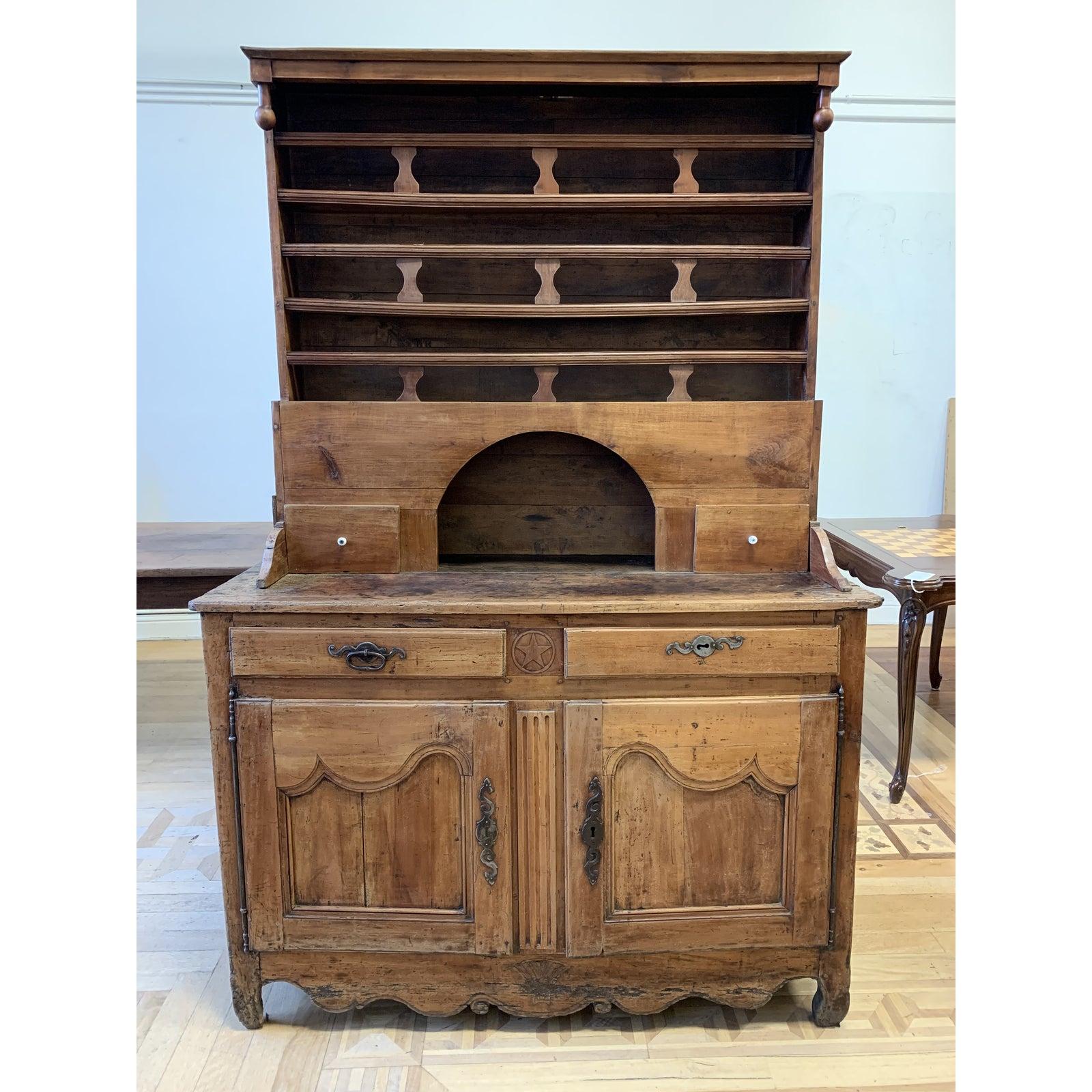 Presents a 19th century French Country buffet / hutch. A blend of solid cherry is handcrafted with mortise and tenon dovetail joinery. Soft curvature and patina adds to the charm of this large sideboard . Arched alcove on top of bar height surface
