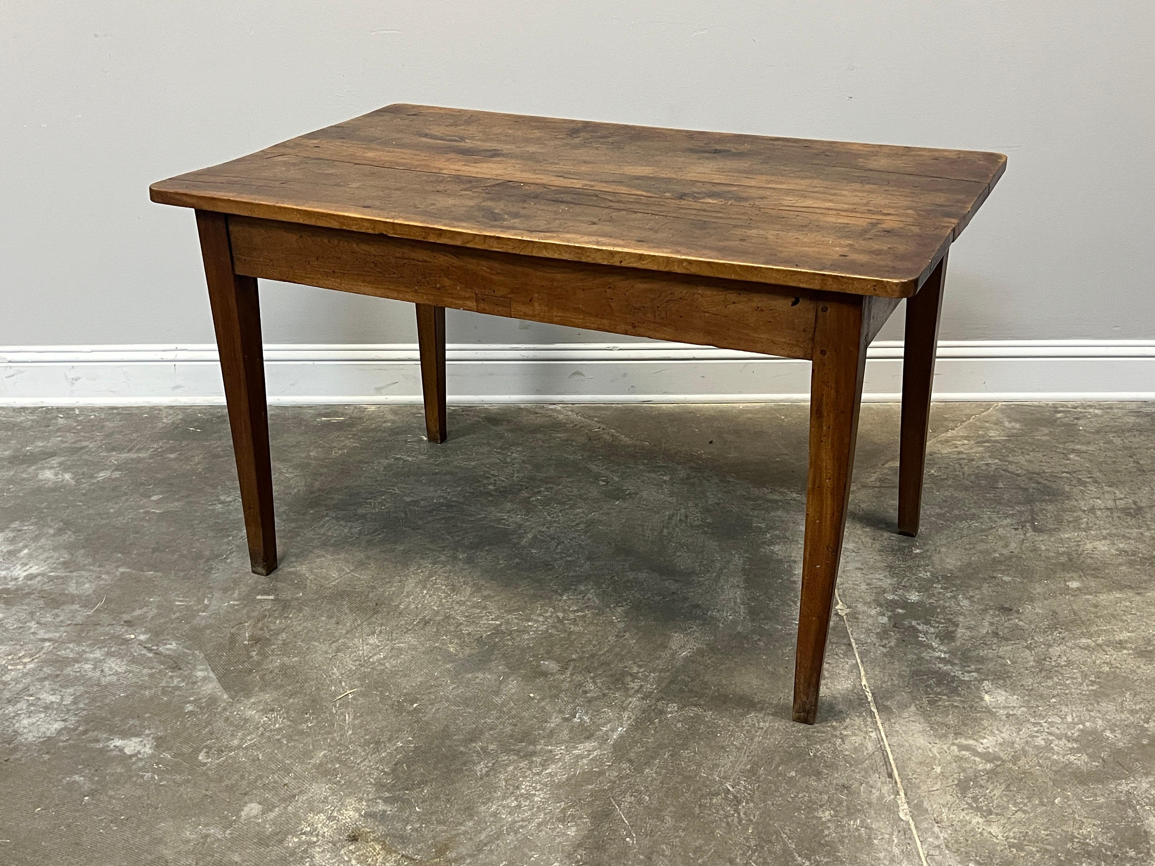 Classic French Provincial farm table in walnut with two drawers, waxed and polished finish. Hand constructed with planed boards, dovetailed drawers and pegged joints. Best used maybe at home in the kitchen or as a desk elsewhere in the home.

Hand