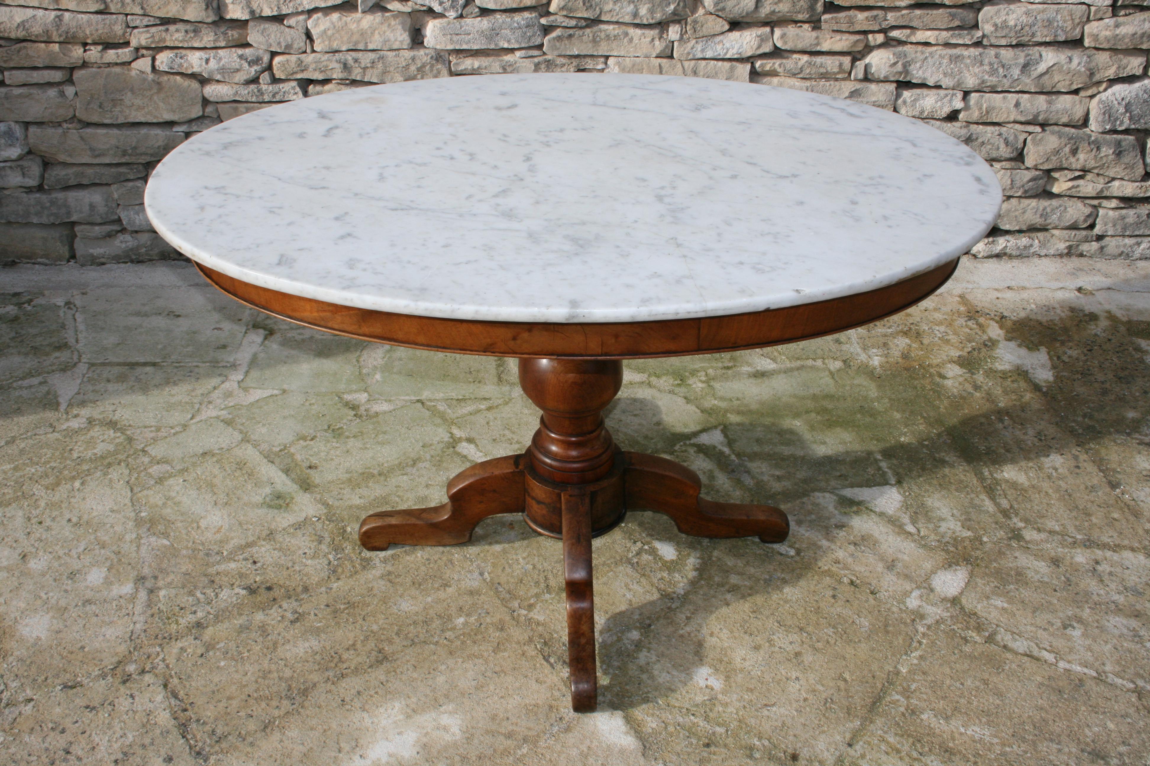 Attractive and practical, 19th century country French side, occasional or tea table. A good size with carved pedestal base and original oval marble top.