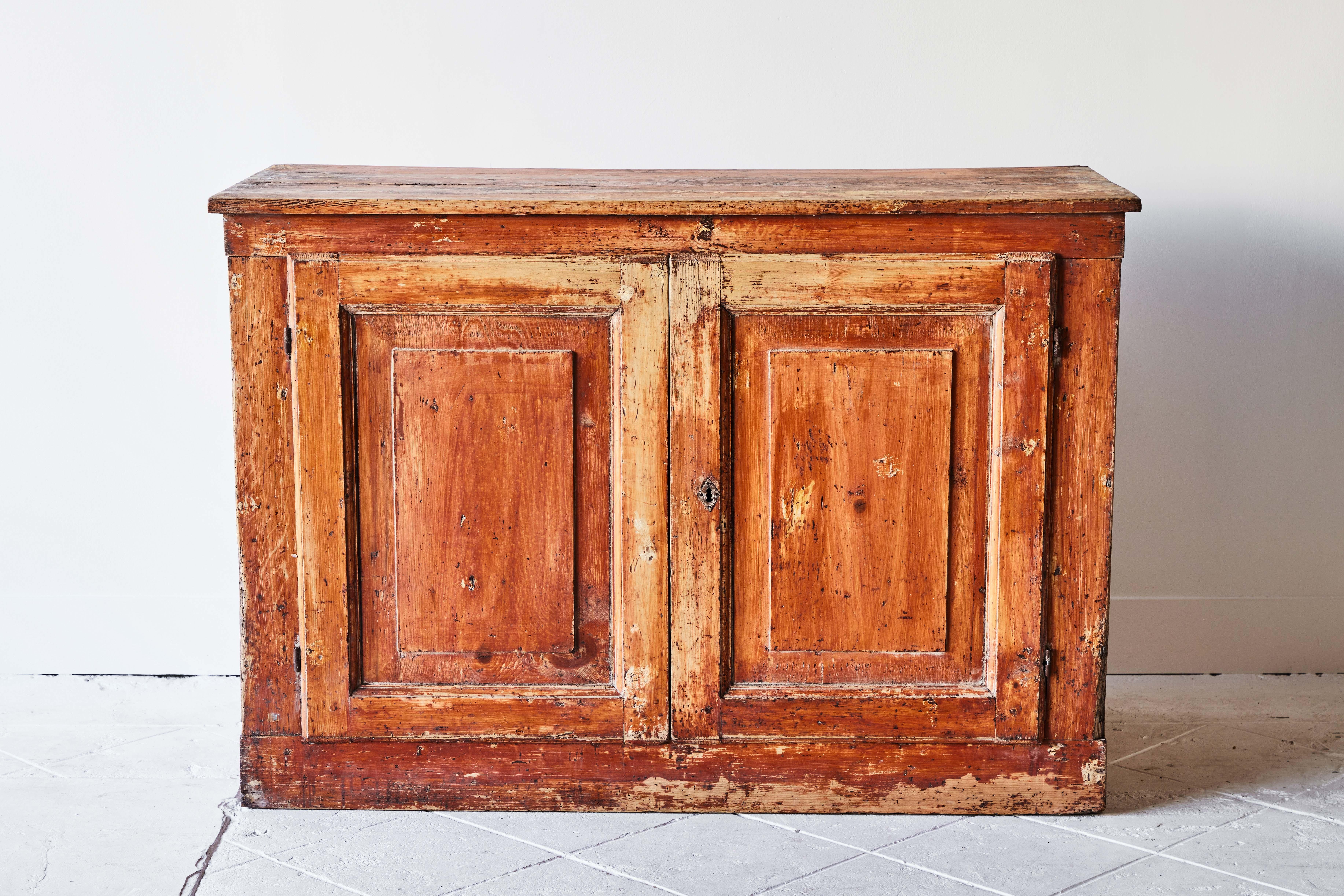 Rustic French country sideboard cabinet in a vibrant burnt orange. Inside is large and roomy with two shelves. Perfect cabinet or cupboard for any room.