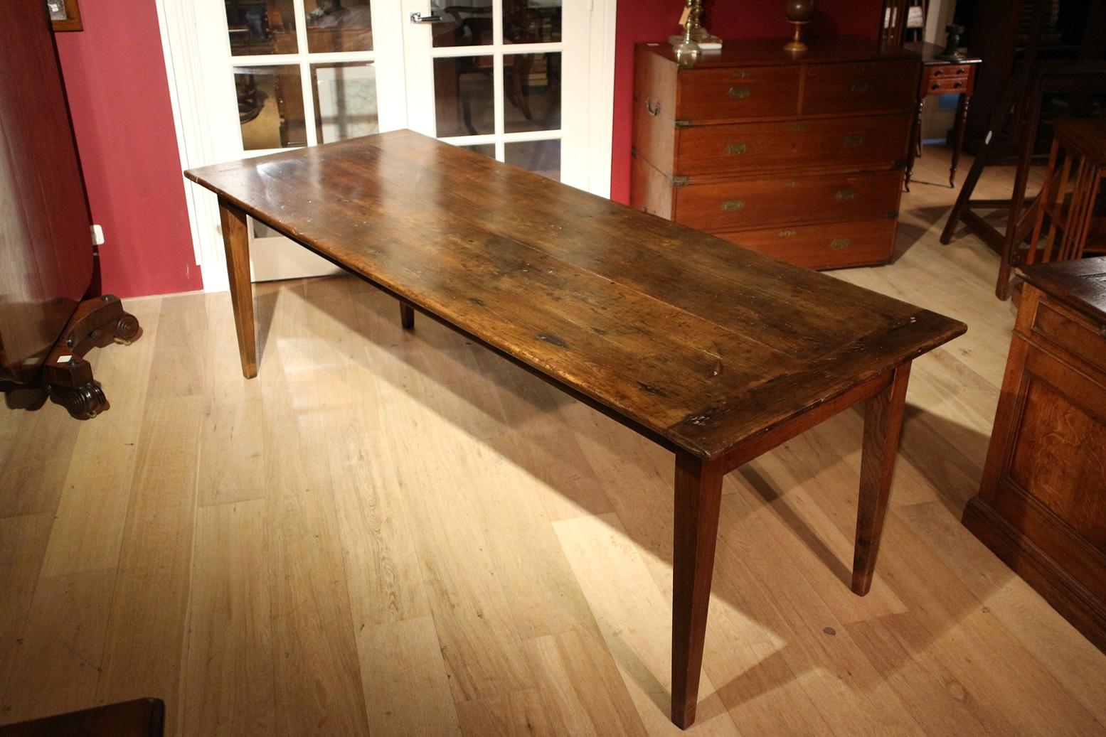 Beautiful large antique French chestnut table. Table is in perfect condition. The table has a drawer at the front. And a pull-out leaf on the other side. Beautifully aged top with a warm colour. Legroom 65 cm

Origin: France
Period: approx.
