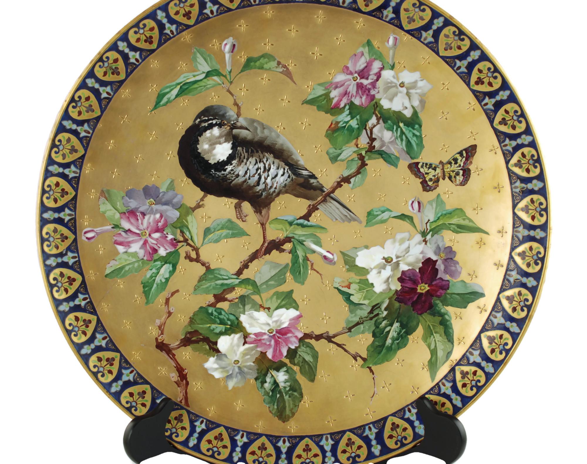 This outstanding hand painted 19th century French ceramic charger was made by Hautin Boulenger & Cie at Creil & Montereau. The highly detailed Aesthetic Movement charger features polychrome decoration depicting a Japanese quail perched in a