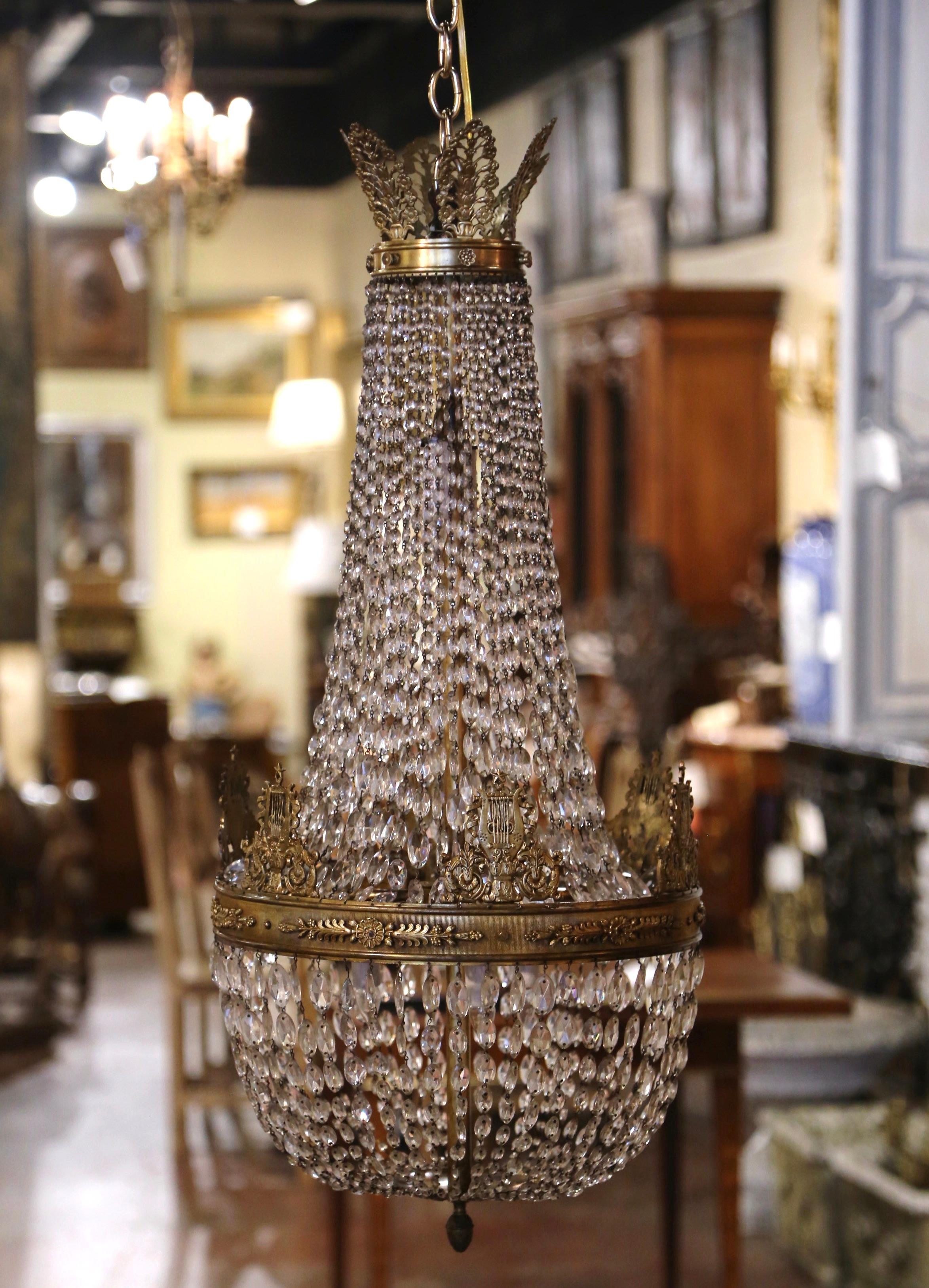 Brighten your hallway with this antique Louis XVI bronze and crystal light fixture; crafted in France, circa 1860, and round in shape, the basket chandelier features five inside lights newly wired. The ceiling fixtures have cut crystal all around,