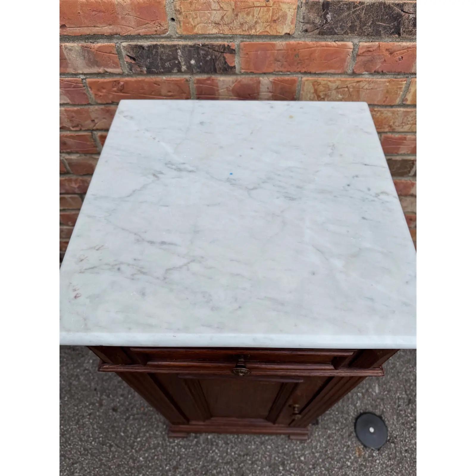 This is a beautiful 19th century bedside table cabinet from France with lovely marble top. This piece can be used as lovely bedside table in a smaller room, a plant stand, drink table, lamp stand or any place needing a touch of table top space or