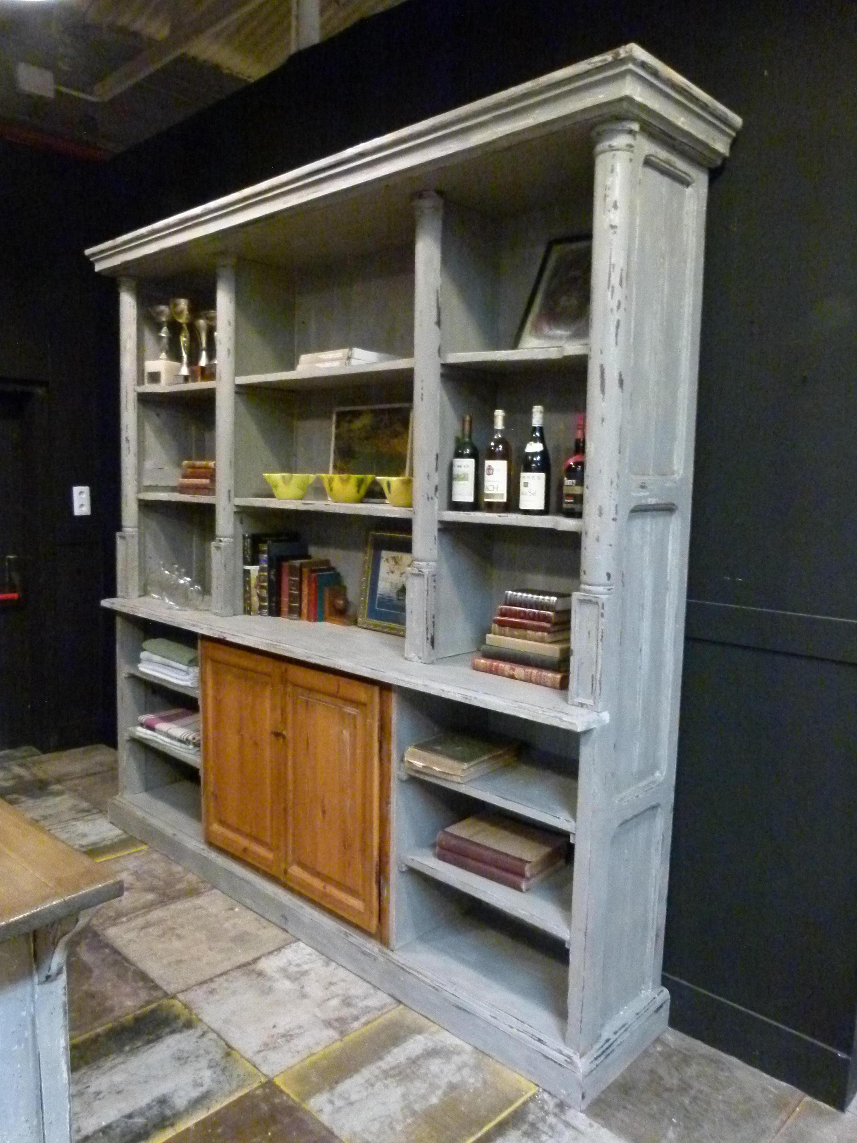  19th century french cupboard with a nice white patina.
 It comprises  lot of space for books or just keeping. There is central  lower cupboard with two wooden doors which are left  in its  natural wood color.



  