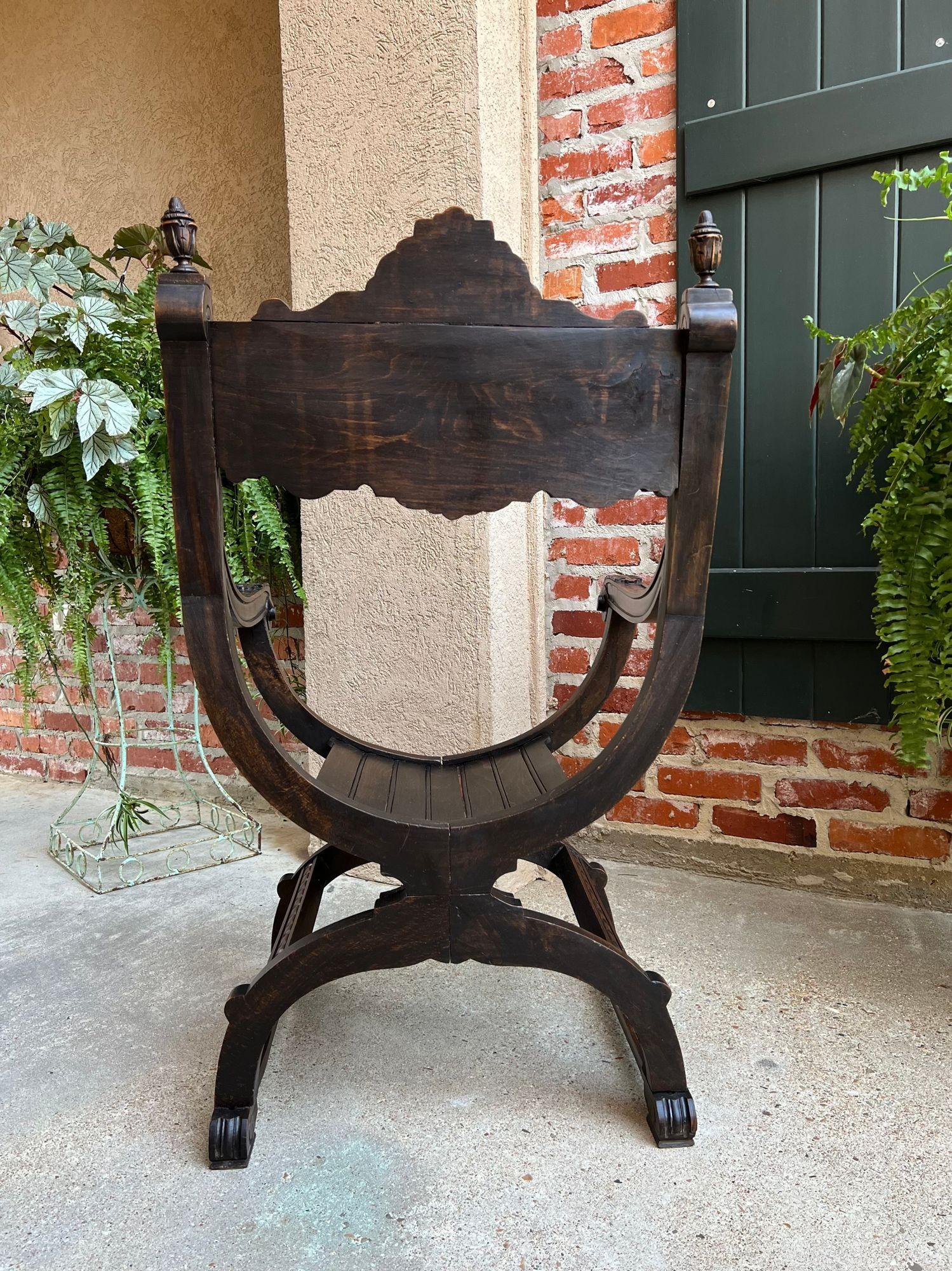 19th Century French Dagobert arm chair carved oak curule throne renaissance.
 
Direct from France, a highly carved antique “Dagobert” chair with beautifully detailed hand carvings from top to bottom.
Of course the “dagobert” throne chair or