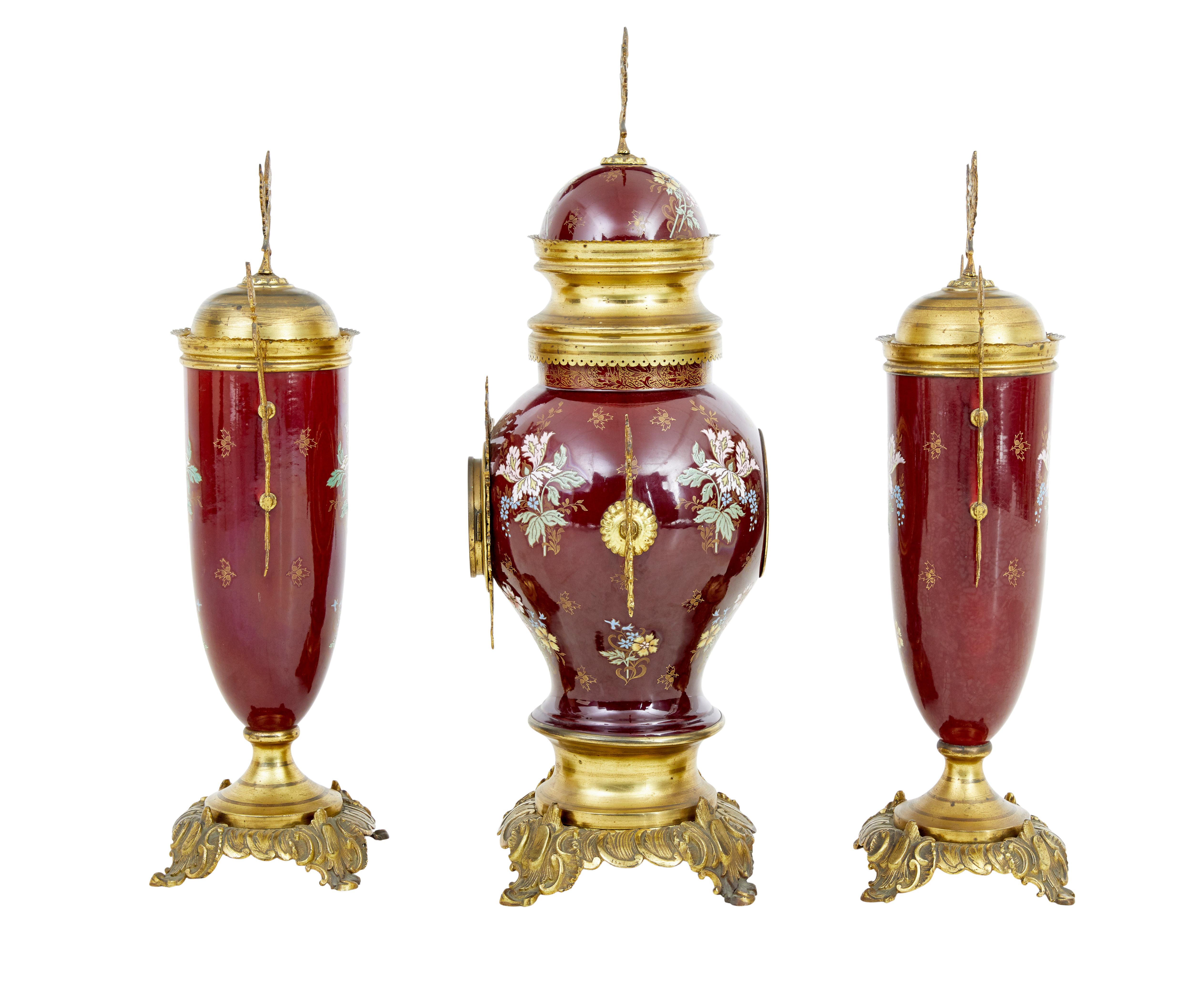 19th century French decorative toleware garniture set, circa 1880.

Fine example of a 3 piece garniture set, hand painted toleware decorated with ornate ormolu mounts. Clock fitted with arabic numerals.

Some fading to ormolu.

We recommend that the