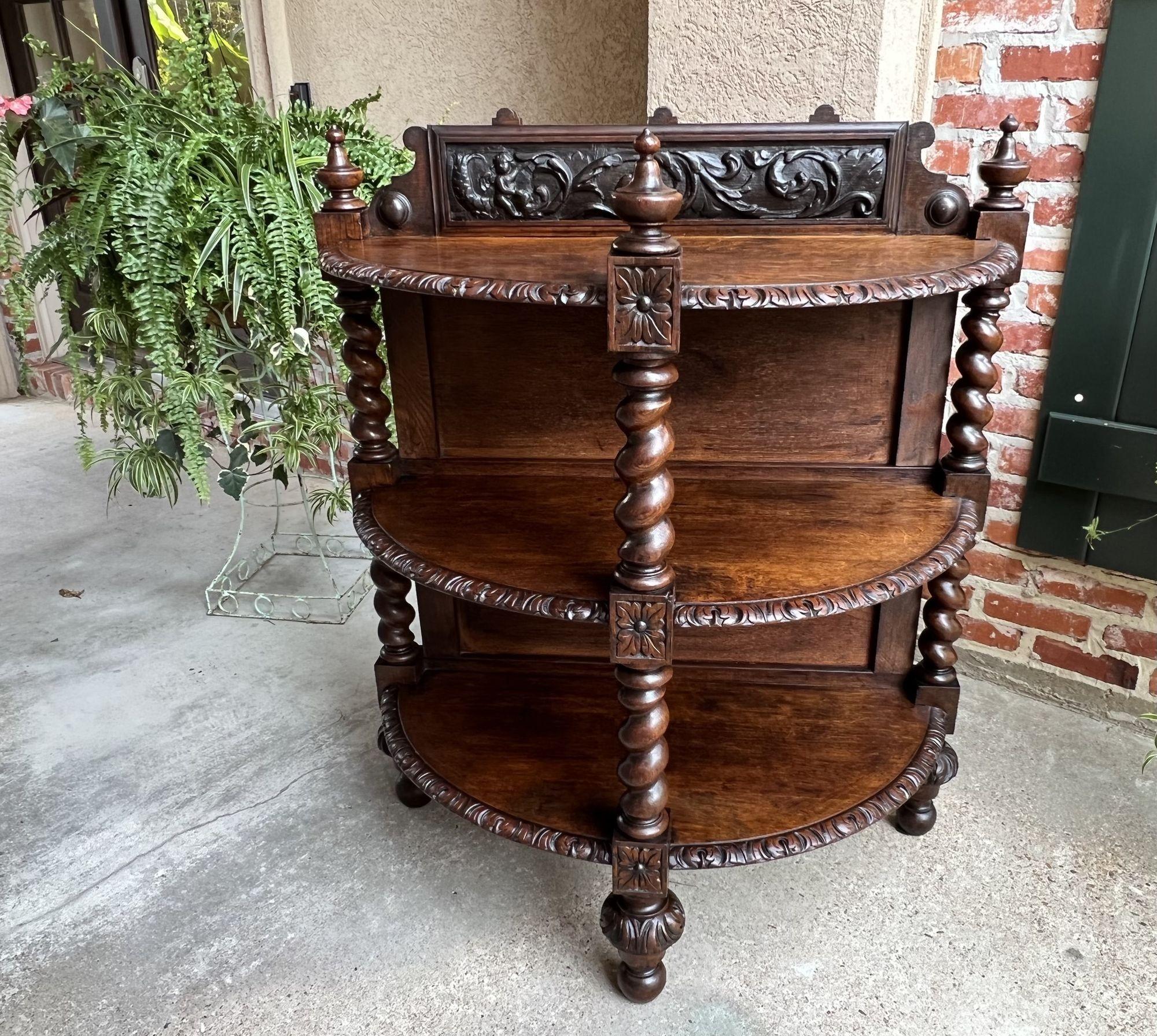 19th century French Demilune table bookcase barley twist carved oak Louis XIII.
 
Direct from France, a very special, highly carved, 19th century French demilune table/server/bookcase shelf! 
Oversized barley twist posts on the front and sides frame