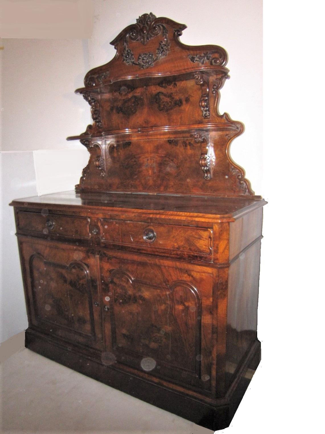 Beautifully hand carved burl walnut, antique country dessert console/ server/ hutch featuring two shelves plus the serving surface with two silverware drawers and double door storage cabinet below. A utilitarian, practical and aesthetic combination