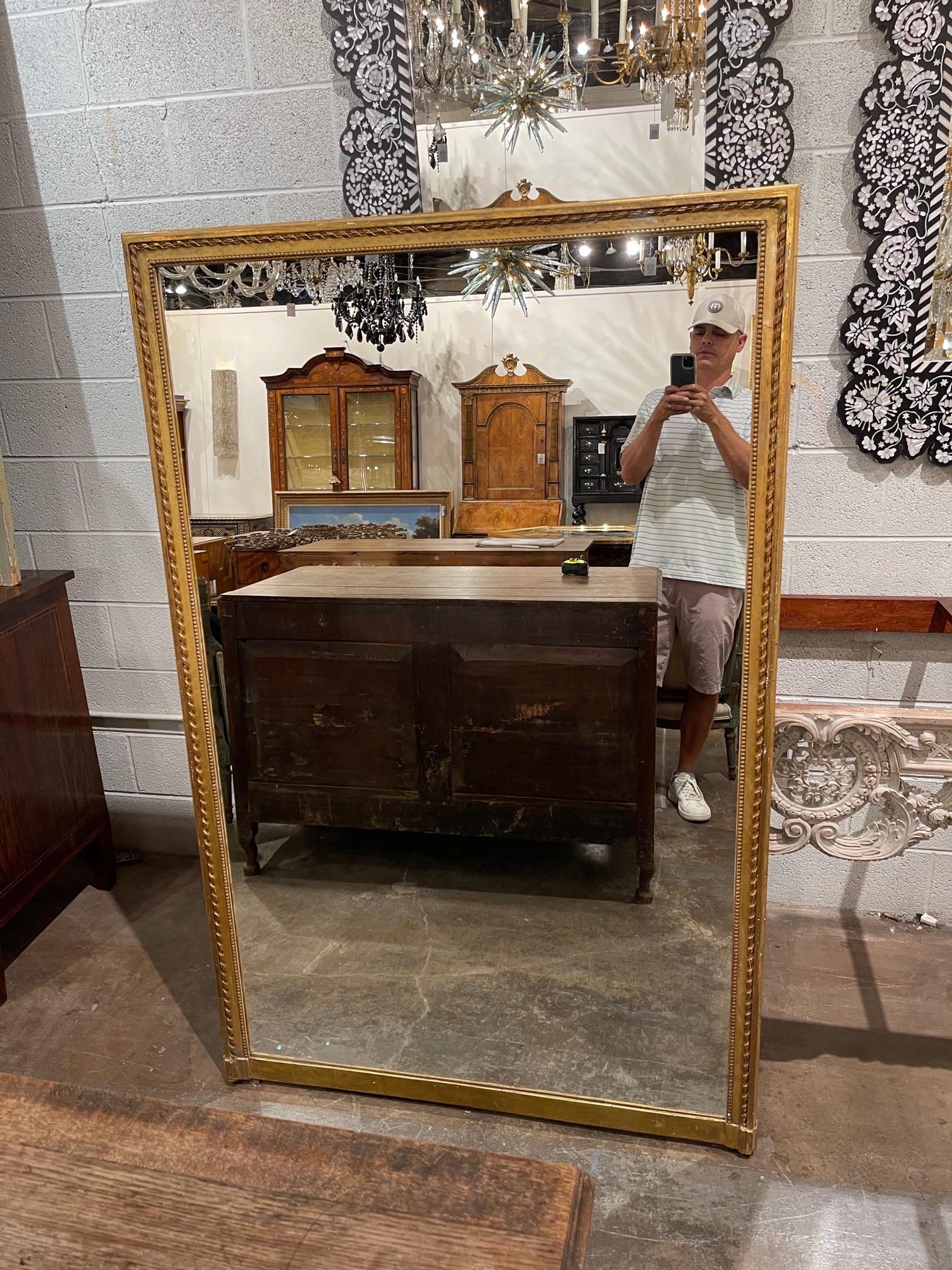 Very fine 19th century French Directoire carved and giltwood mirror. A classic style for a fine home. Great for a variety of decors!