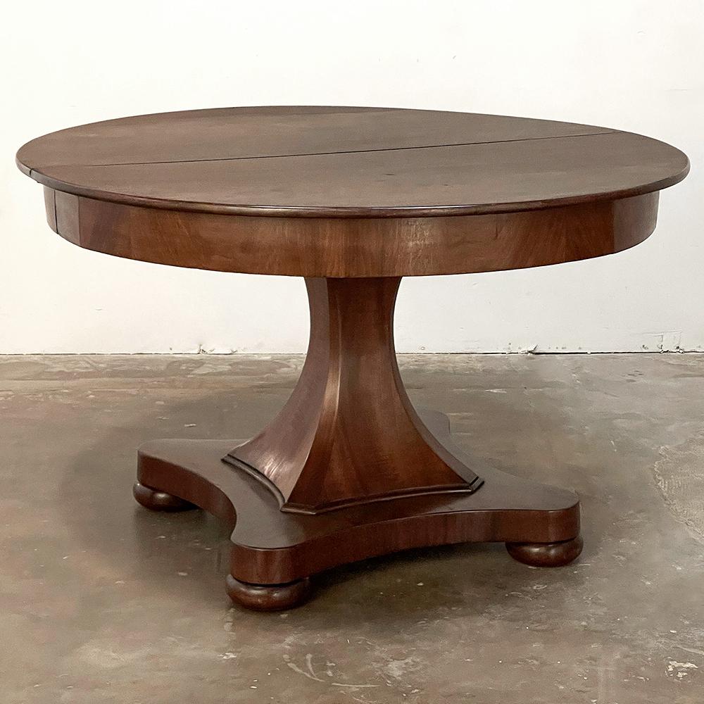 19th century French Directoire Mahogany Centre Table ~ Dining Table is a sublimely elegant expression of the style that was born during the lifetime of Napoleon Bonaparte, emphasizing clean, classical lines and tailored architecture which keeps the