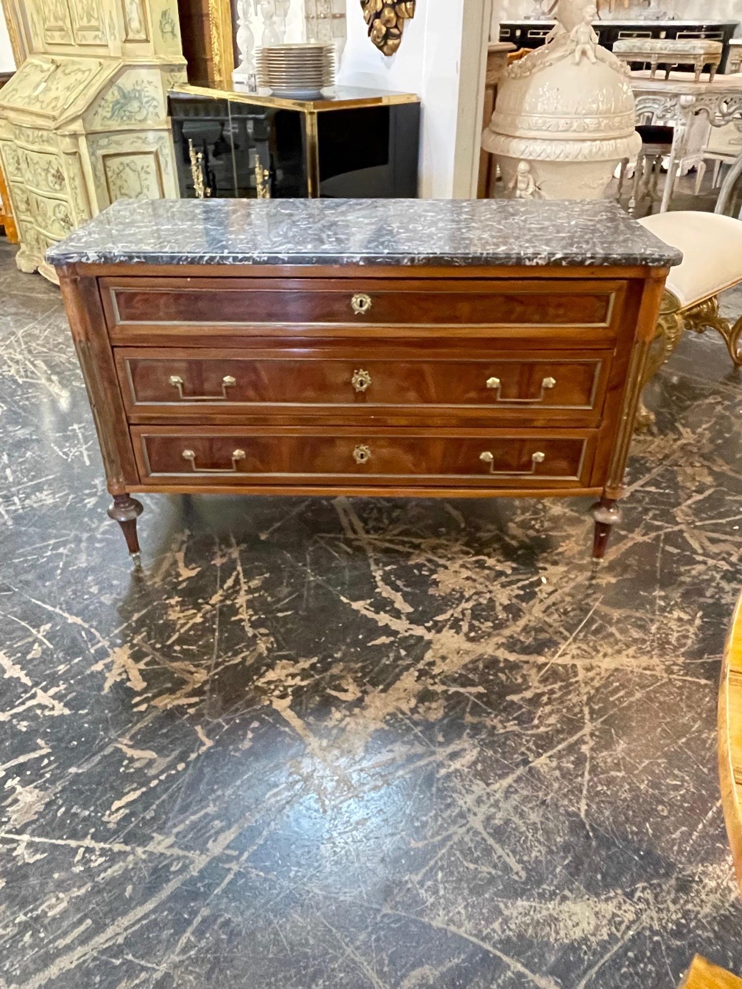Elegant 19th century French Directoire Mahogany commode with brass trim and grey marble top. Beautiful clean lines. A classic piece. So pretty!