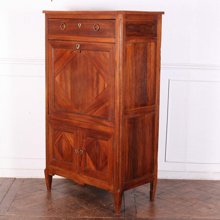 Beautiful French cherrywood simple Directoire period fall-front secretary with geometric diamond inlay motif to fall front and lower doors, and with a handsome fitted interior with eleven drawers. Lovely colour and patina. C. 1820.

