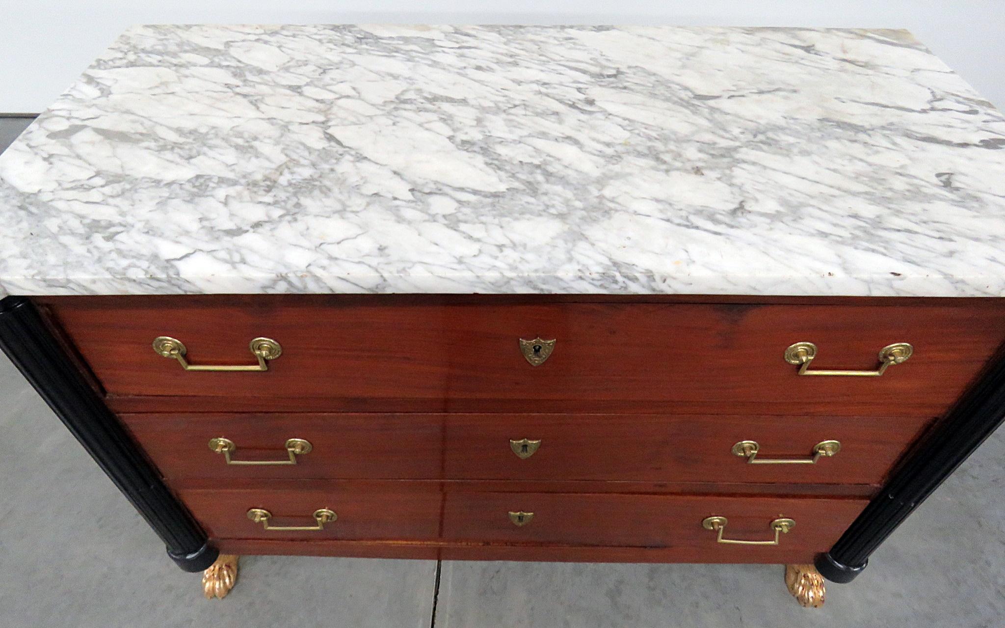19th century French Directoire style 3-drawer marble-top commode with gilt and ebonized accents.