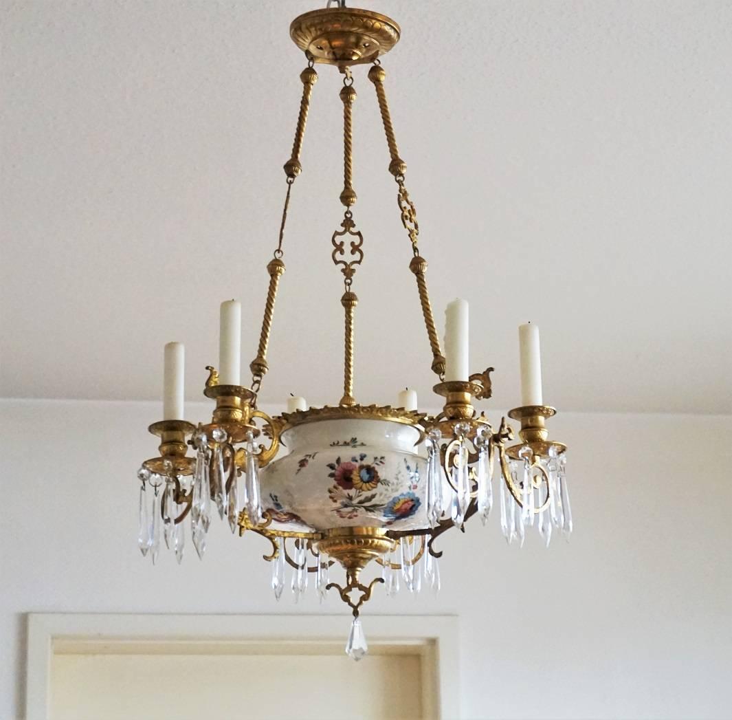 A high quality antique French doré bronze candleholder chandelier decorated with crystal drops, circa 1870-1880. The body is made of hand-painted faience by Hautin & Boulanger Choisy-le-Roi, surrounded by three ornate gilt bronze double arms mounted