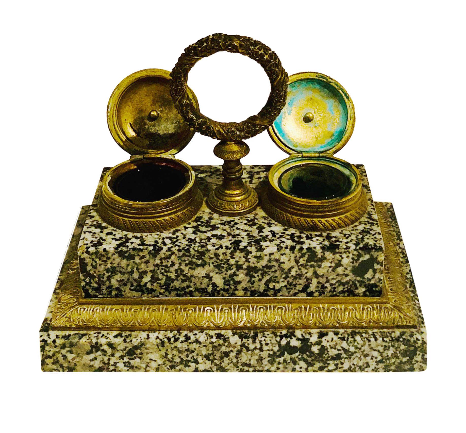 A doré bronze and marble inkwell. It is French in the Empire style. Compartments have their little glass containers for ink and are all original.