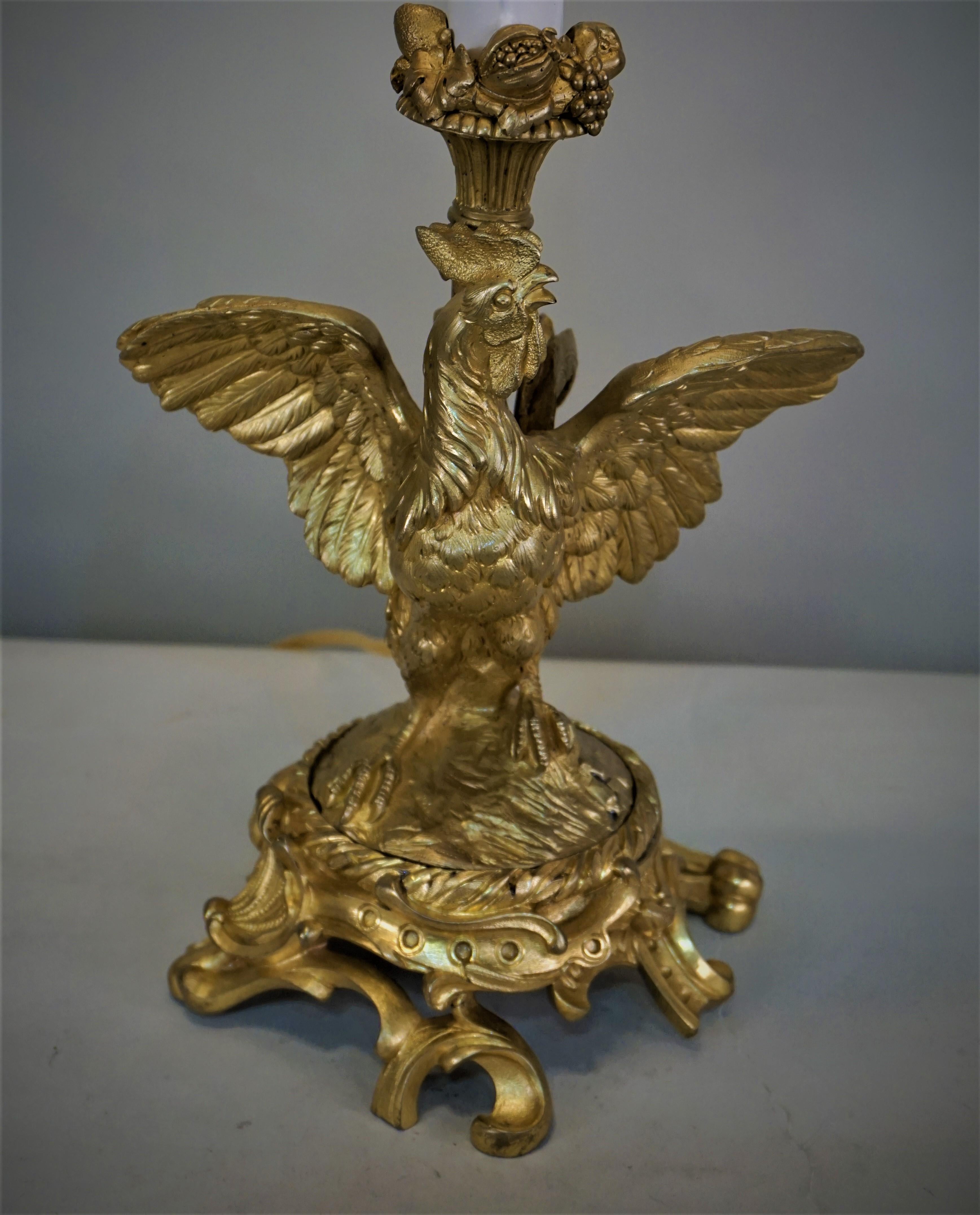 Electrified 19th century doré bronze roster candle stick Table lamp.