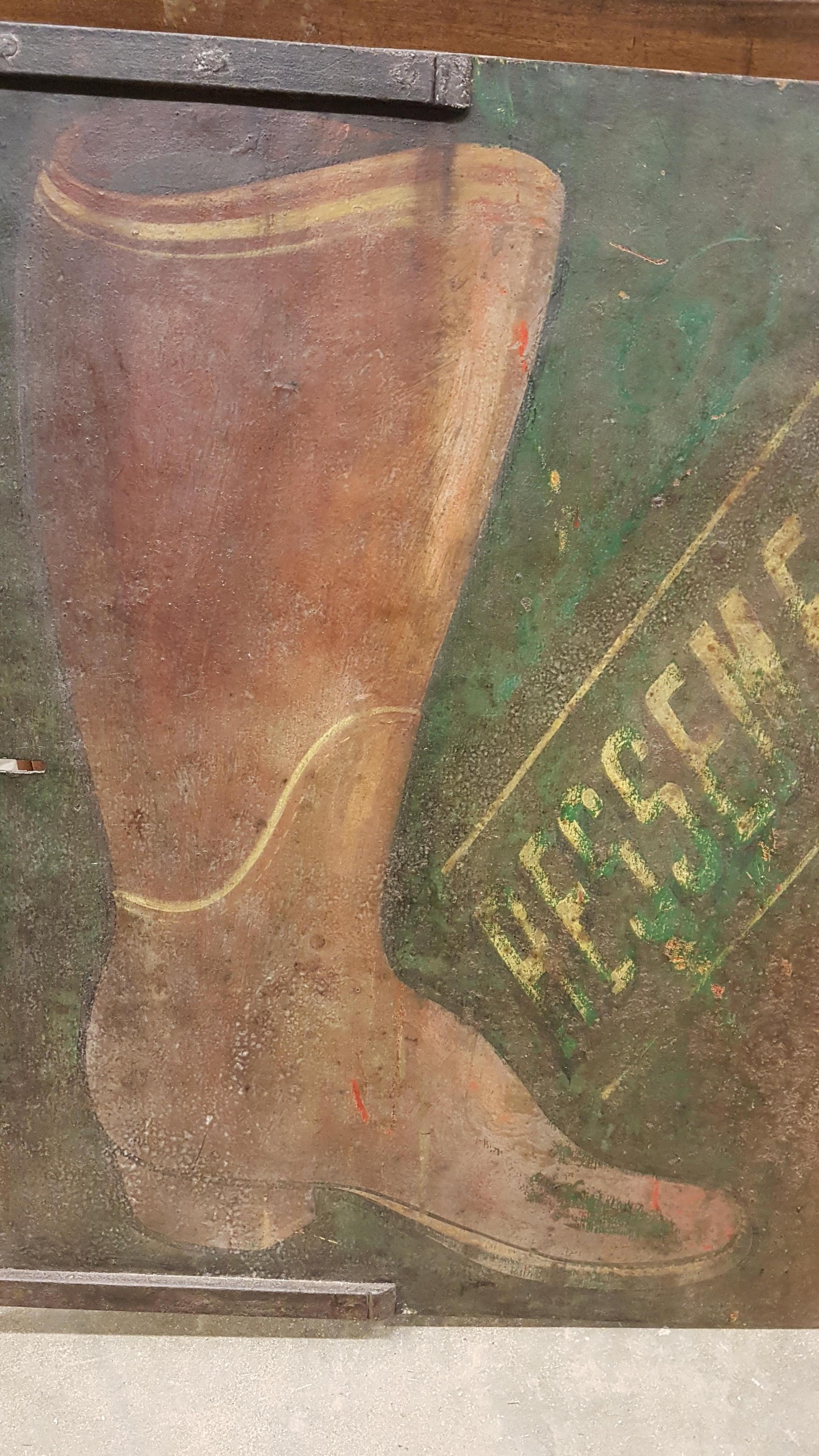 A beautiful and unique large iron French trade sign for a boot repair shop, it says on the sign 'Ressemelage' which translates as 'resoling', new soles on old boots. It is double sided, one side has the paint in better condition to the other, the