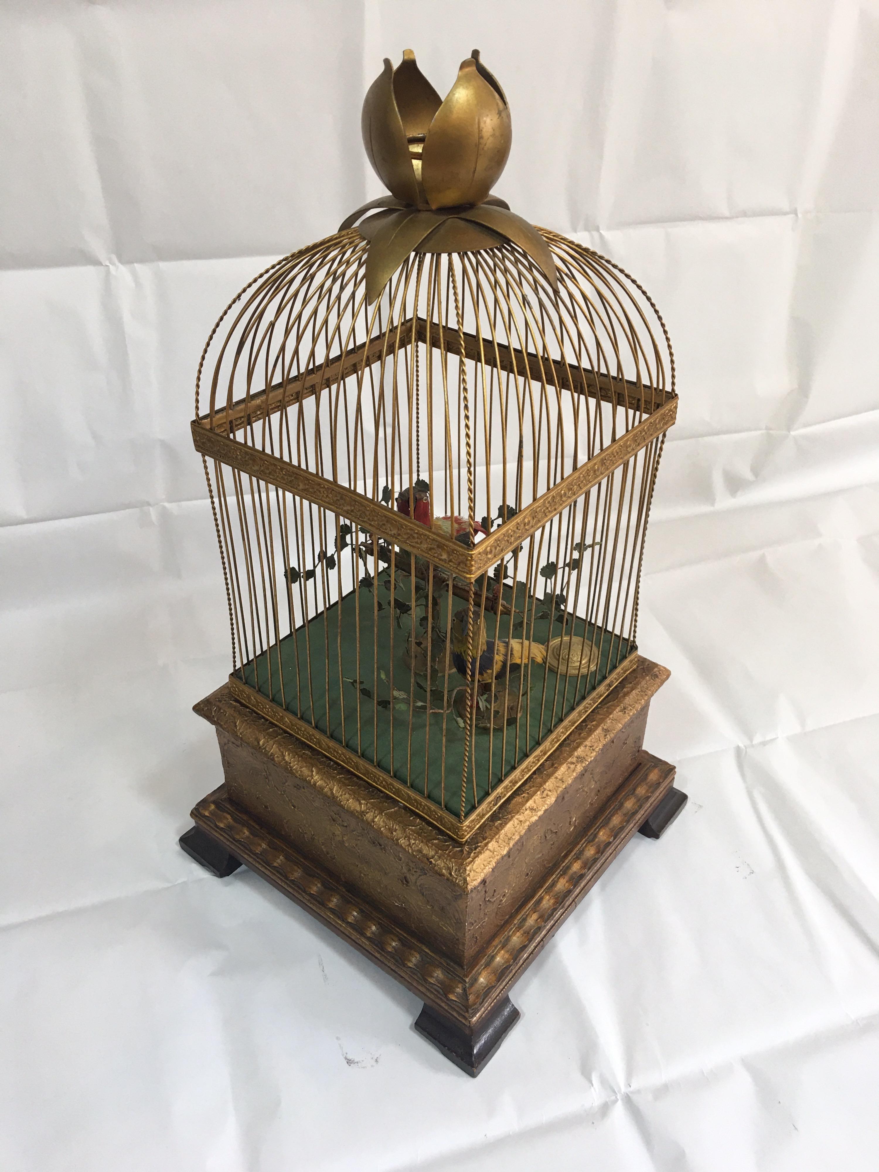 This stunning Victorian period french double singing bird in a cage automation is in good working condition. Each of the brightly coloured birds with feather plumage, with head, beak and tail movements, within a gilt brass cage with control lever to