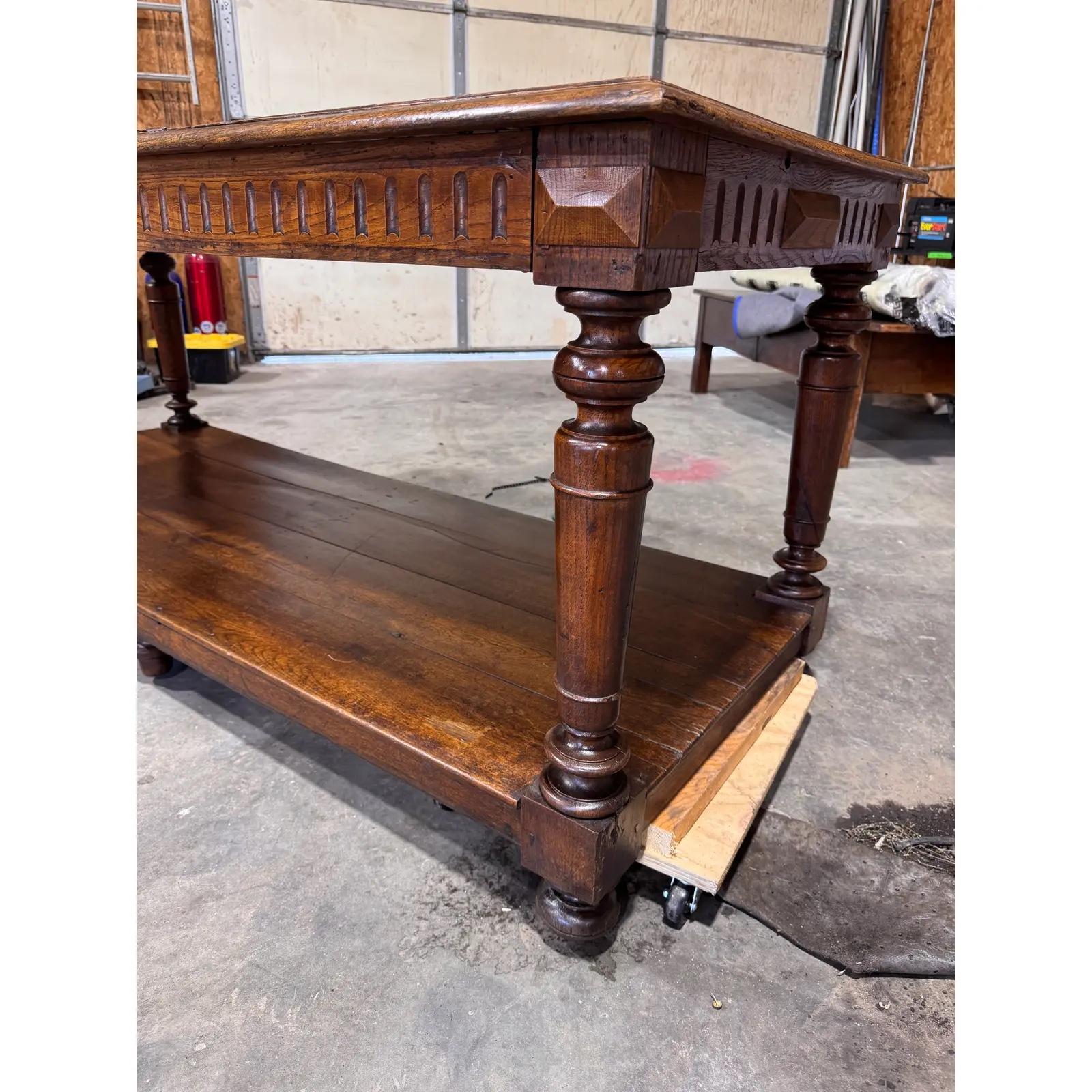 This is an early 19th century French Drapers table. These tables were primarily used by cloth merchants and tailors in the 18th and 19th centuries to unroll, measure, cut, and fold large bolts of fabric.
While their original purpose has diminished