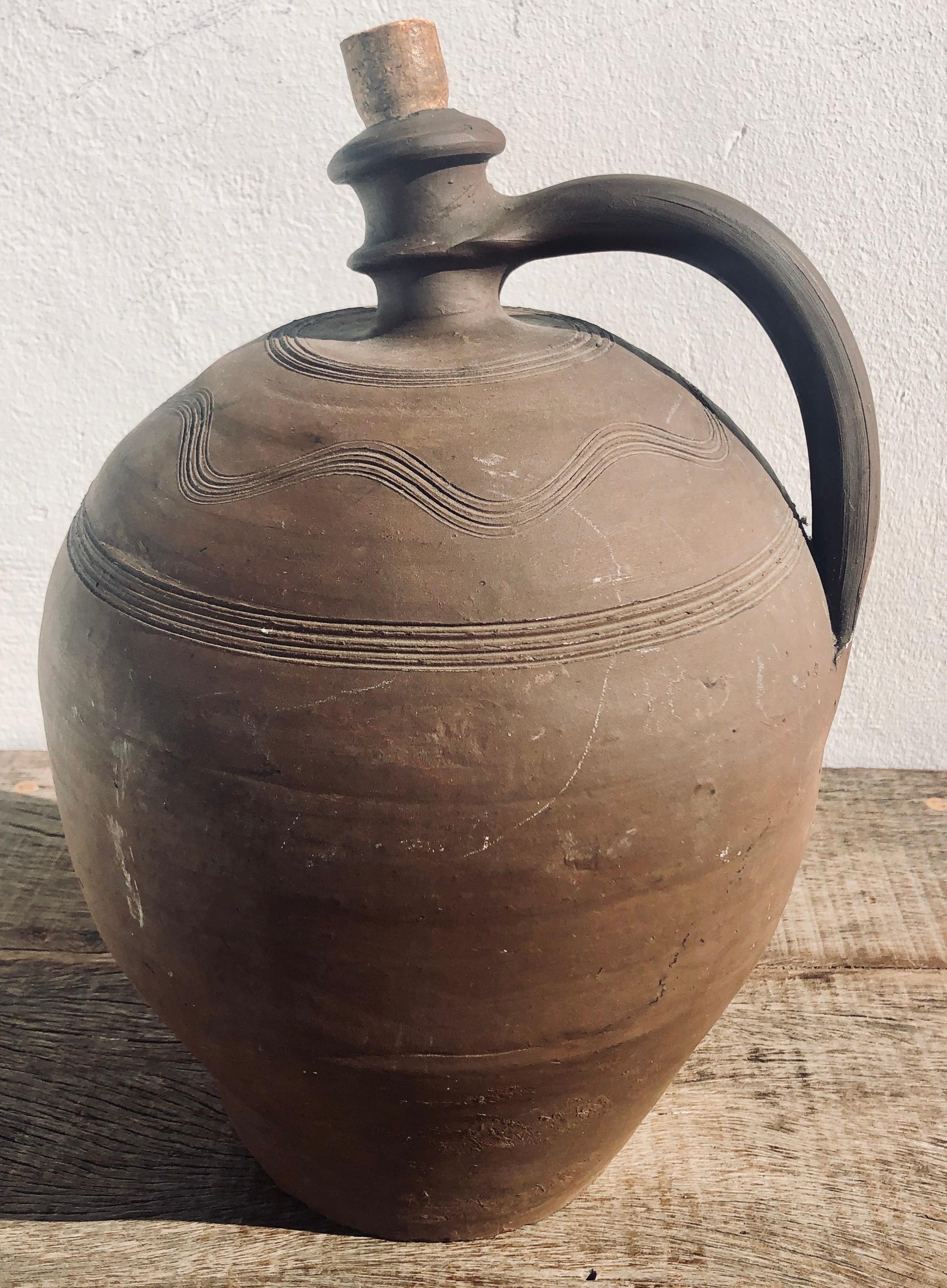 Unique French 19th ceramic decorative pottery with narrow corked neck, used to stored liquids as oil or wine. It is in great original condition, it is believed to be from the Mid-1800s, it shows signs of its age and use, it's got few chips and