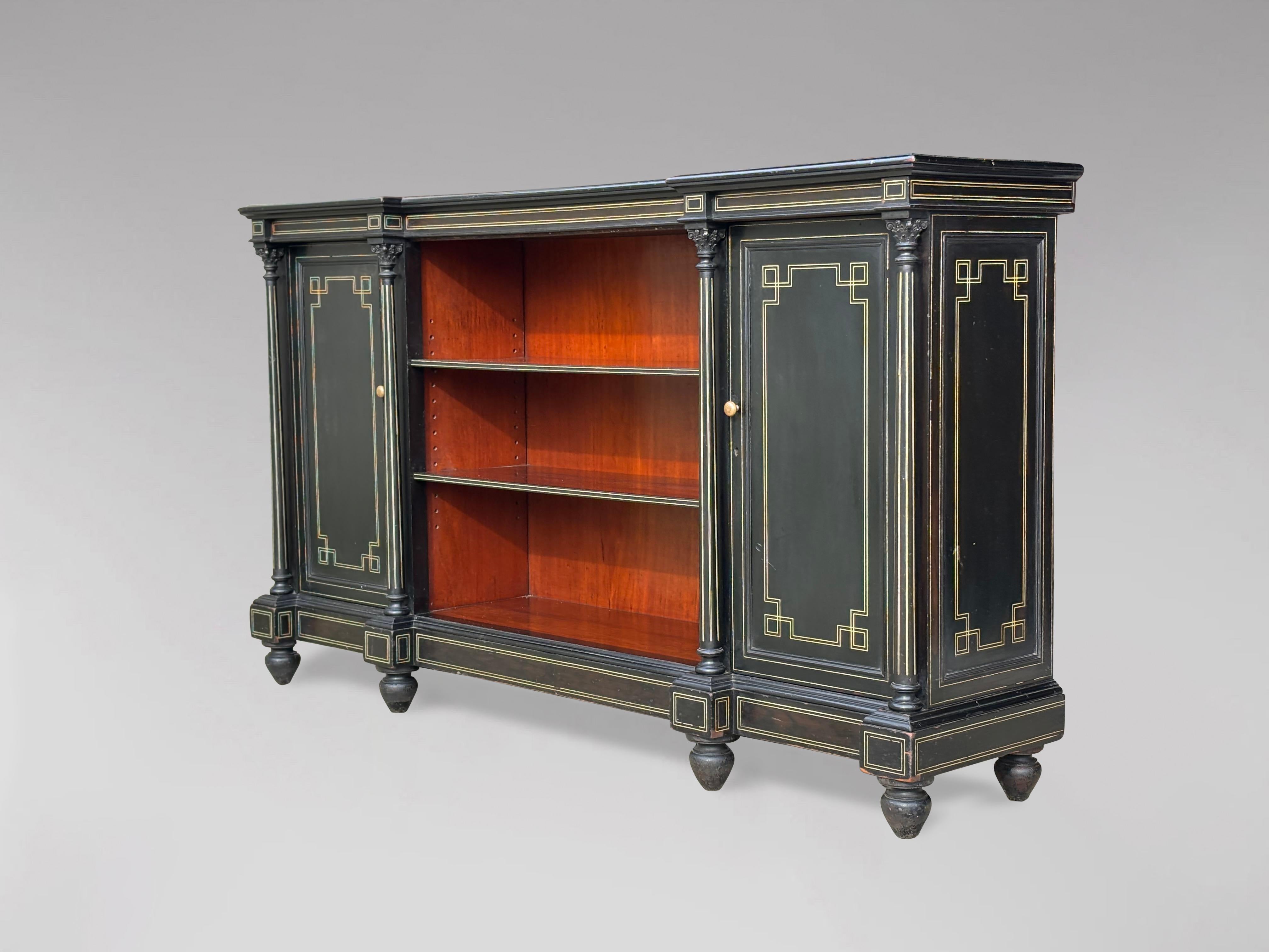 A fine and very decorative late 19th century French ebonised & bone inlay enfilade, buffet or sideboard. Moulded and bone inlay shaped top above an open central section with two adjustable shelves, flanked by inlaid panelled doored cabinets, four