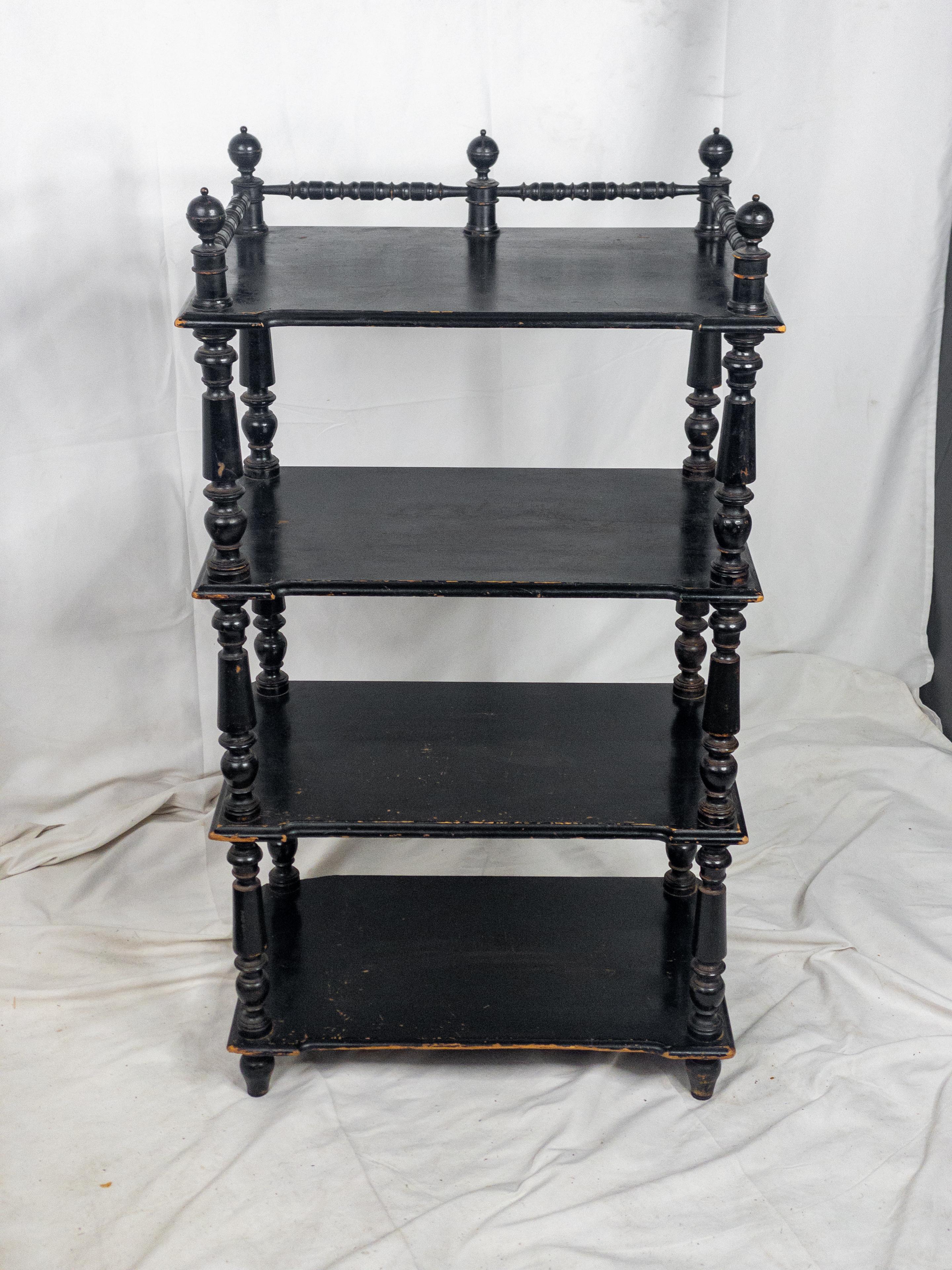 Step into the opulent charm of the 19th Century French Ebonized Shelf, a timeless fusion of craftsmanship and elegance. This exquisite piece boasts beautifully carved and turned legs, showcasing the intricate artistry synonymous with French design