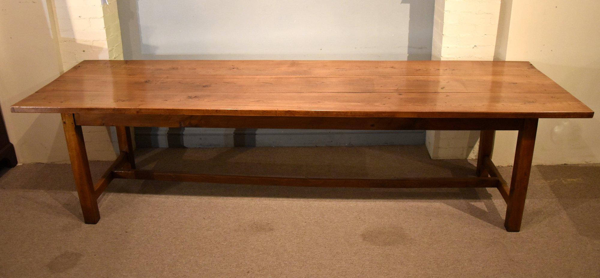 This beautiful and very sturdy 19th century French elm farmhouse table of large proportions boasts excellent golden colour and good patina. Its three plank and purely solid elm construction makes this a rare find. It has been restored by one of