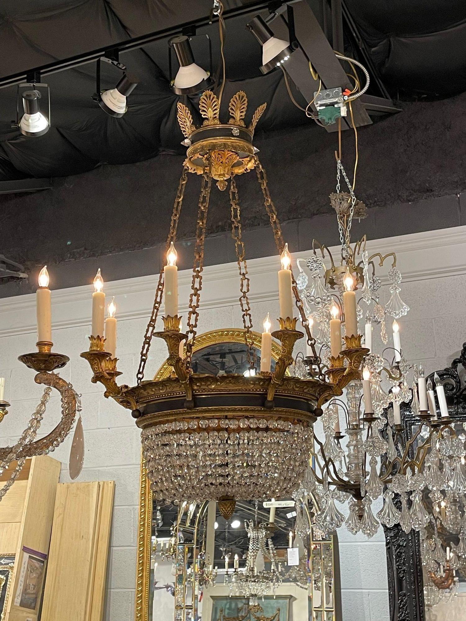 Elegant 19th century French Empire style basket chandelier. Featuring a decorative bronze base, chain and canopy and glistening crystal.  So pretty!!