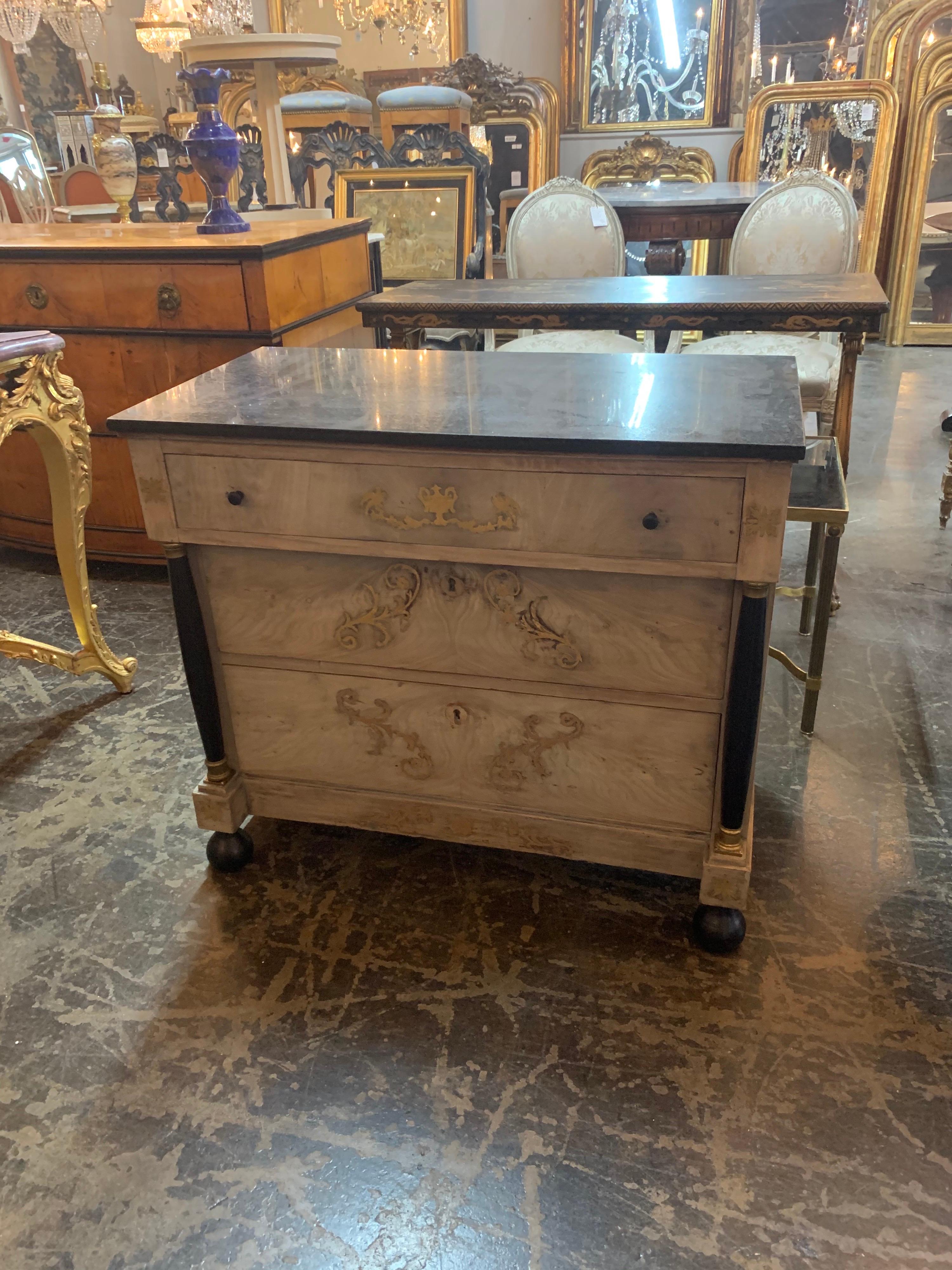 Lovely 19th century French Empire bleached mahogany chest with brass inlay. Very nice black marble top as well. The bleached wood gives a new twist to a classic style. Gorgeous!!