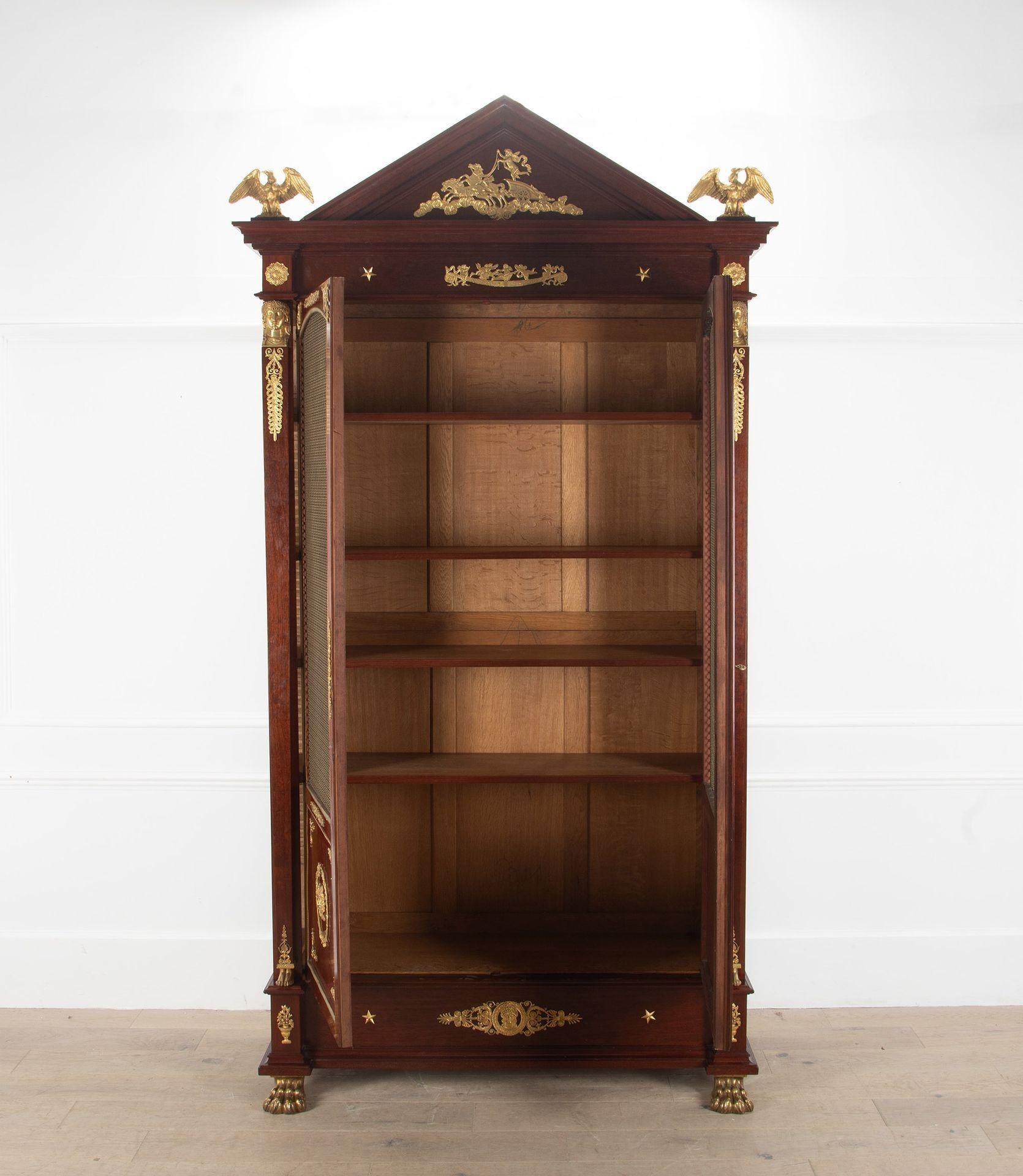 Stunning 19th Century Empire bookcase.

With ormolu mounts featuring winged eagles and bronze ball and claw feet. This is in wonderful condition and is a superb example.