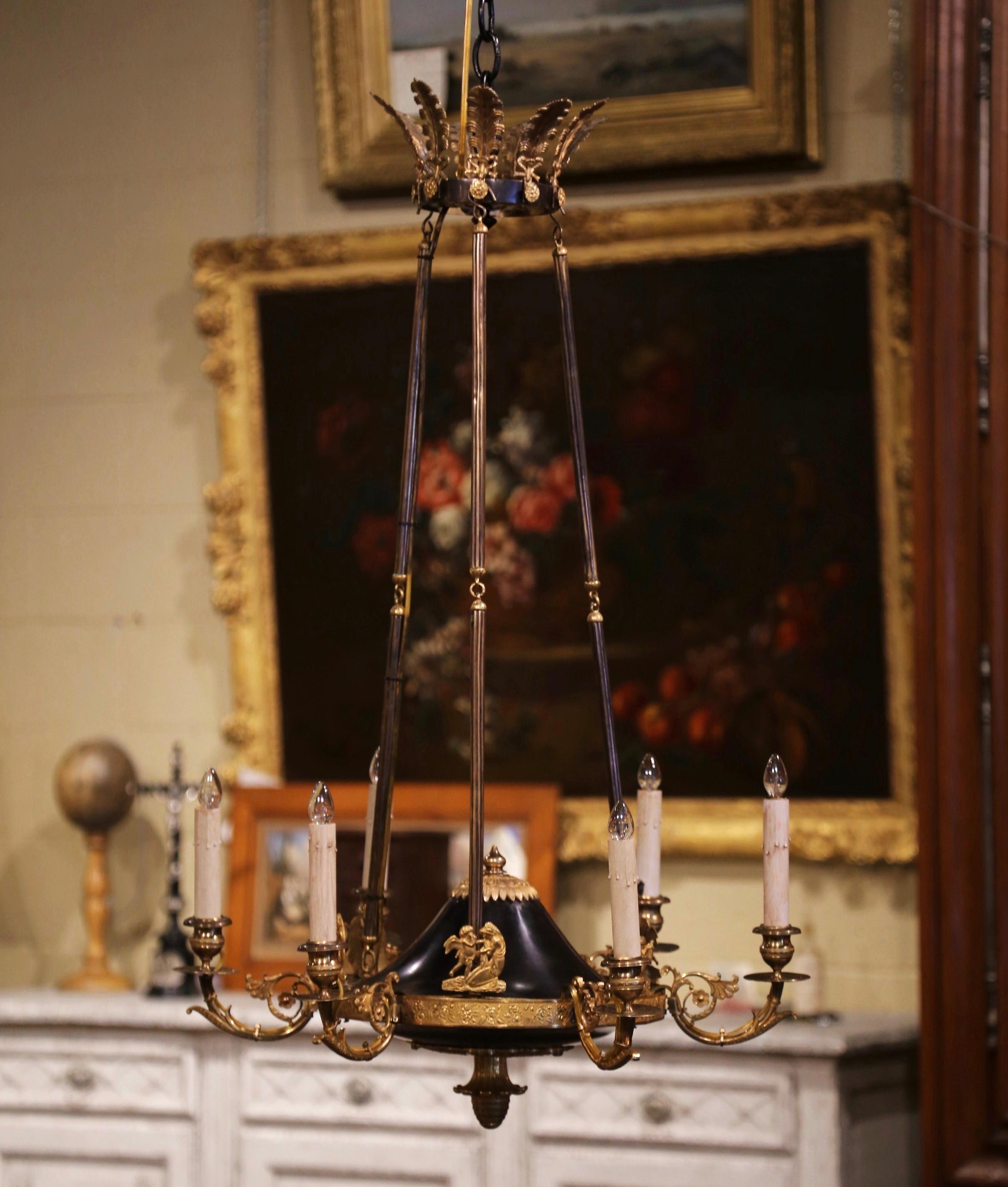 Brighten a entry or a powder room with this sophisticated antique Empire chandelier. Crafted of solid bronze in Paris France, circa 1860, the wall hanging fixture is circular in shape and has six scrolled arms; each light has been newly wired and