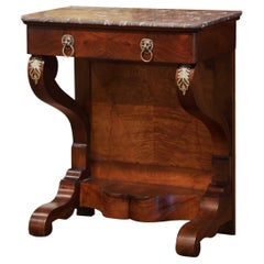 Mesa consola de palisandro tallado y tapa de mármol gris del Imperio francés del siglo XIX