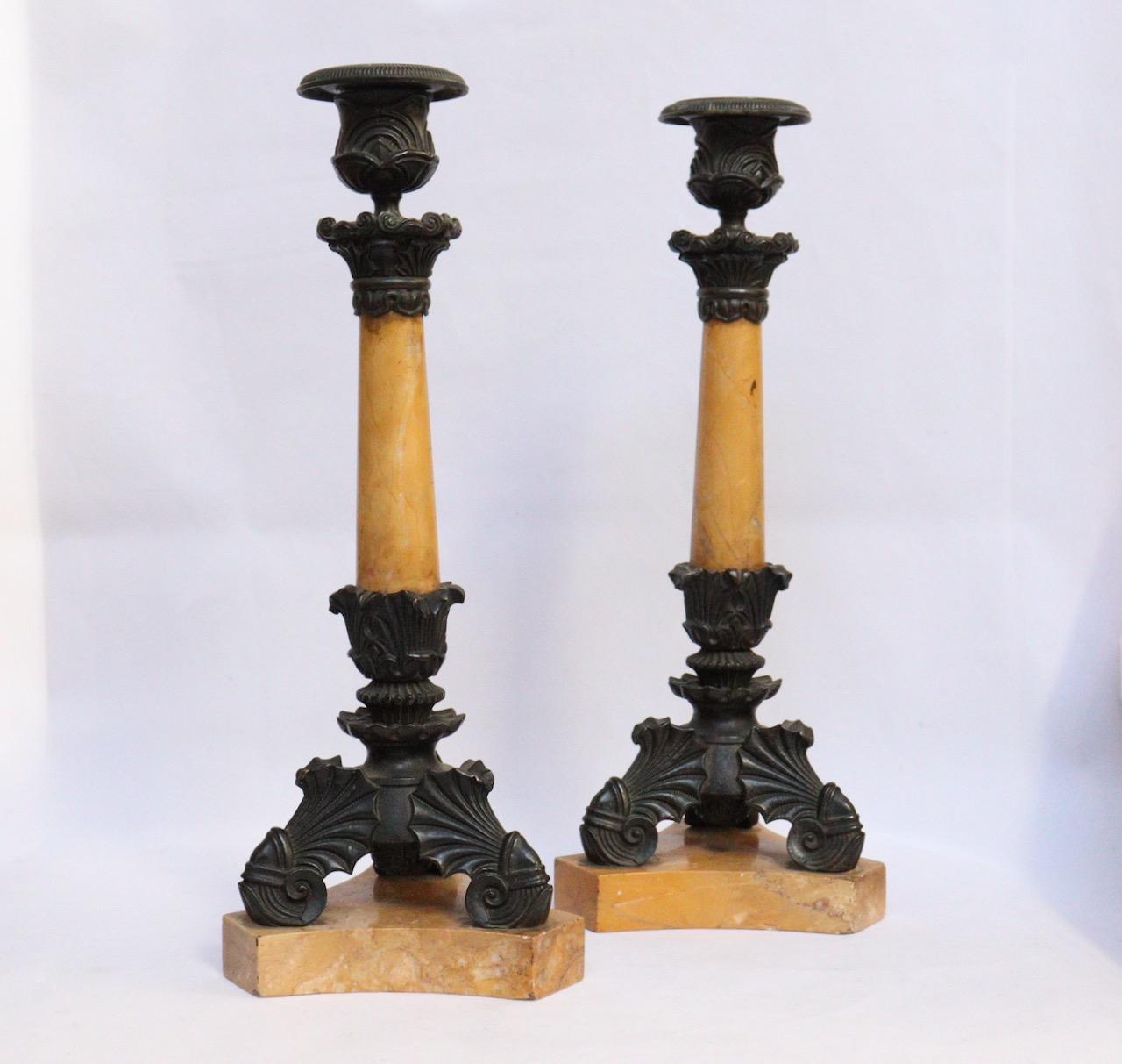 A 19th century French Empire pair of gilt candlesticks
In Siena yellow marble and patinated bronze finely chiselled with palmettes and acanthus leaves.
Charles X Style
Circa 1830.


 