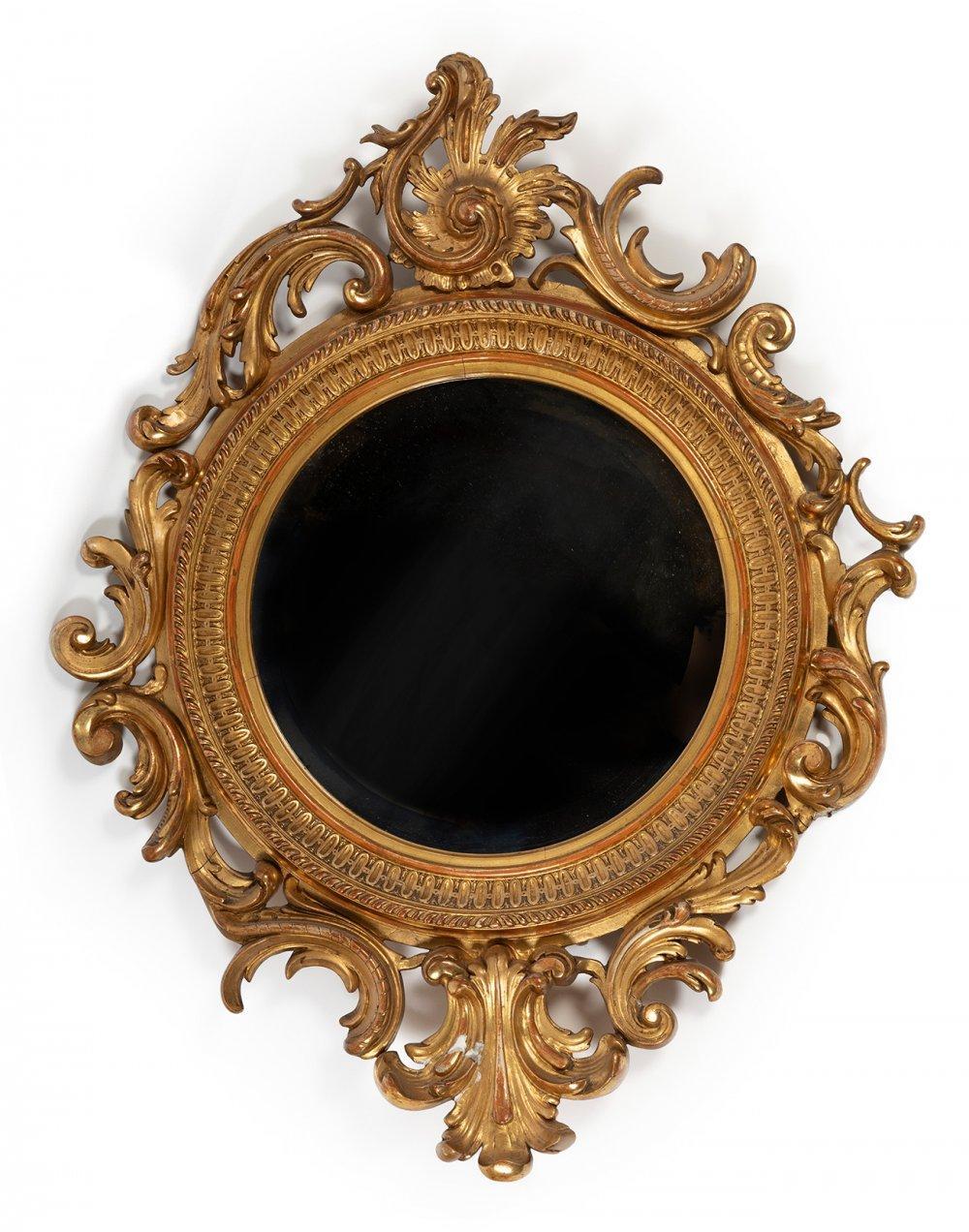 Anonymous
Europe; ca. 1870
Giltwood and stucco

Approximate size: 33.5 (h) x 26.25 (w) x 1 (d) inches

An elegant giltwood and stucco framed rounded mirror in the French Empire style. Profuse foliate motifs and scrolling acanthi surround a molded