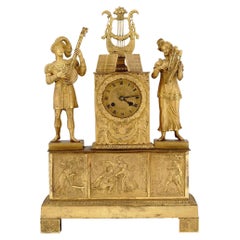 Französisches Kaiserreich im 19. Jahrhundert  Kaminuhr aus vergoldeter Bronze mit Musikthema