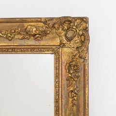 Espejo de pared francés de estilo Imperio del siglo XIX, con marco de madera dorada y diseño elegante