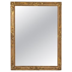 Espejo de pared francés de estilo Imperio del siglo XIX, con marco de madera dorada y diseño elegante