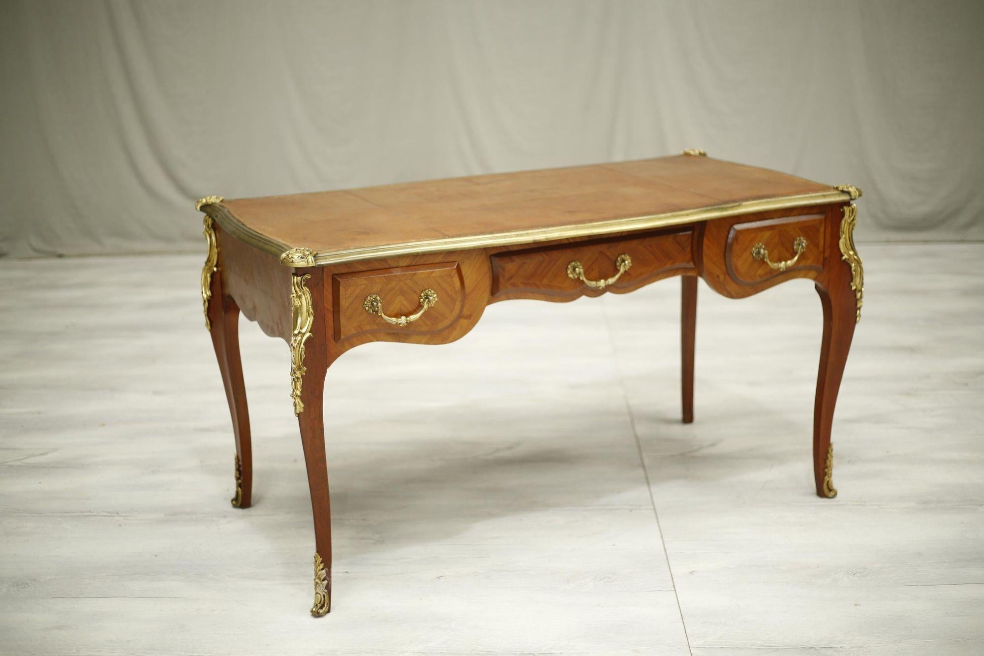 This is an exceptional quality 19th century French empire desk. The mahogany and red leather top are in very attractive original condition with brass mounts on each leg and the top boarded with brass edge which I absolutely love. Great patina to the